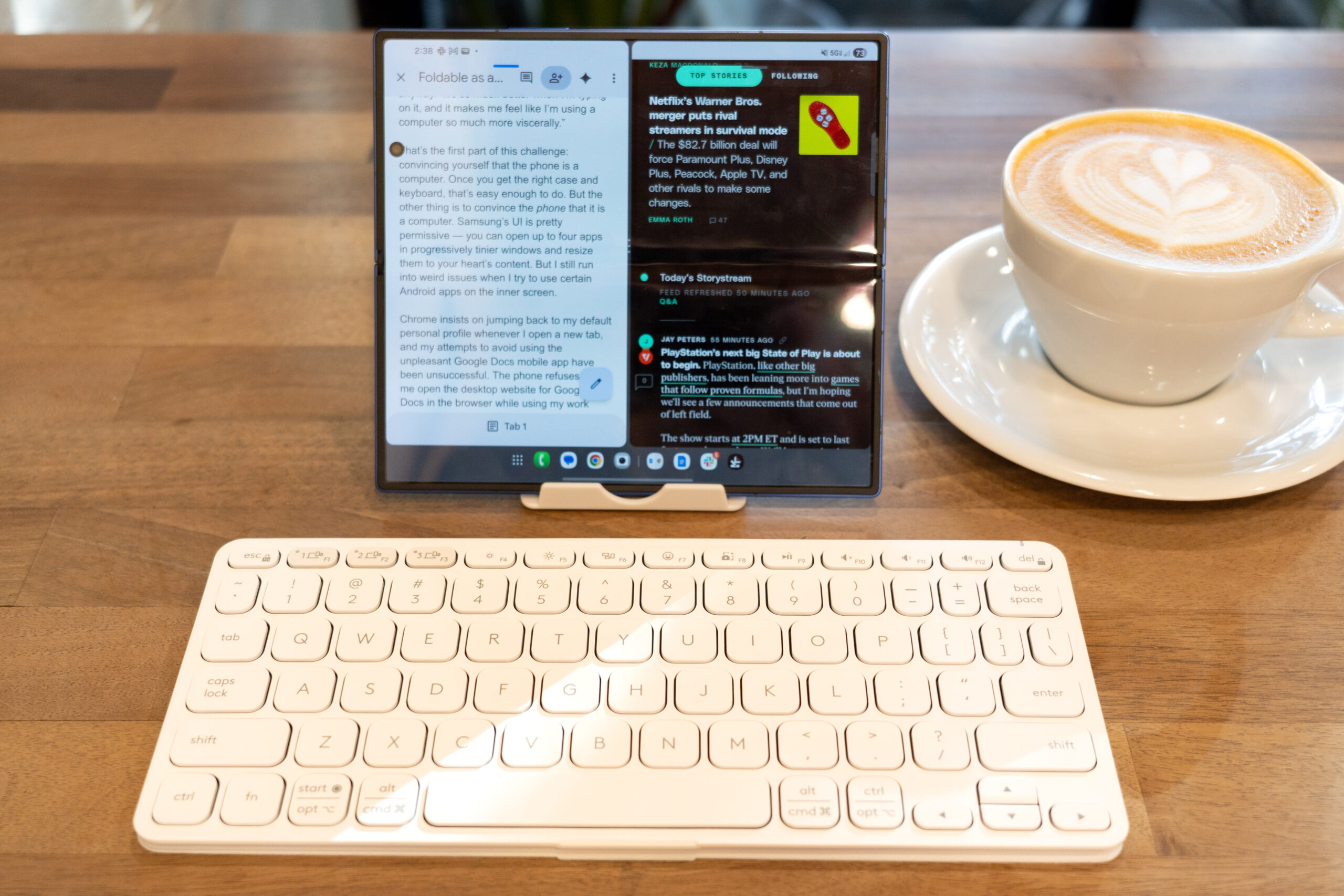 Foldable propped up on a table with a wireless keyboard in front of it