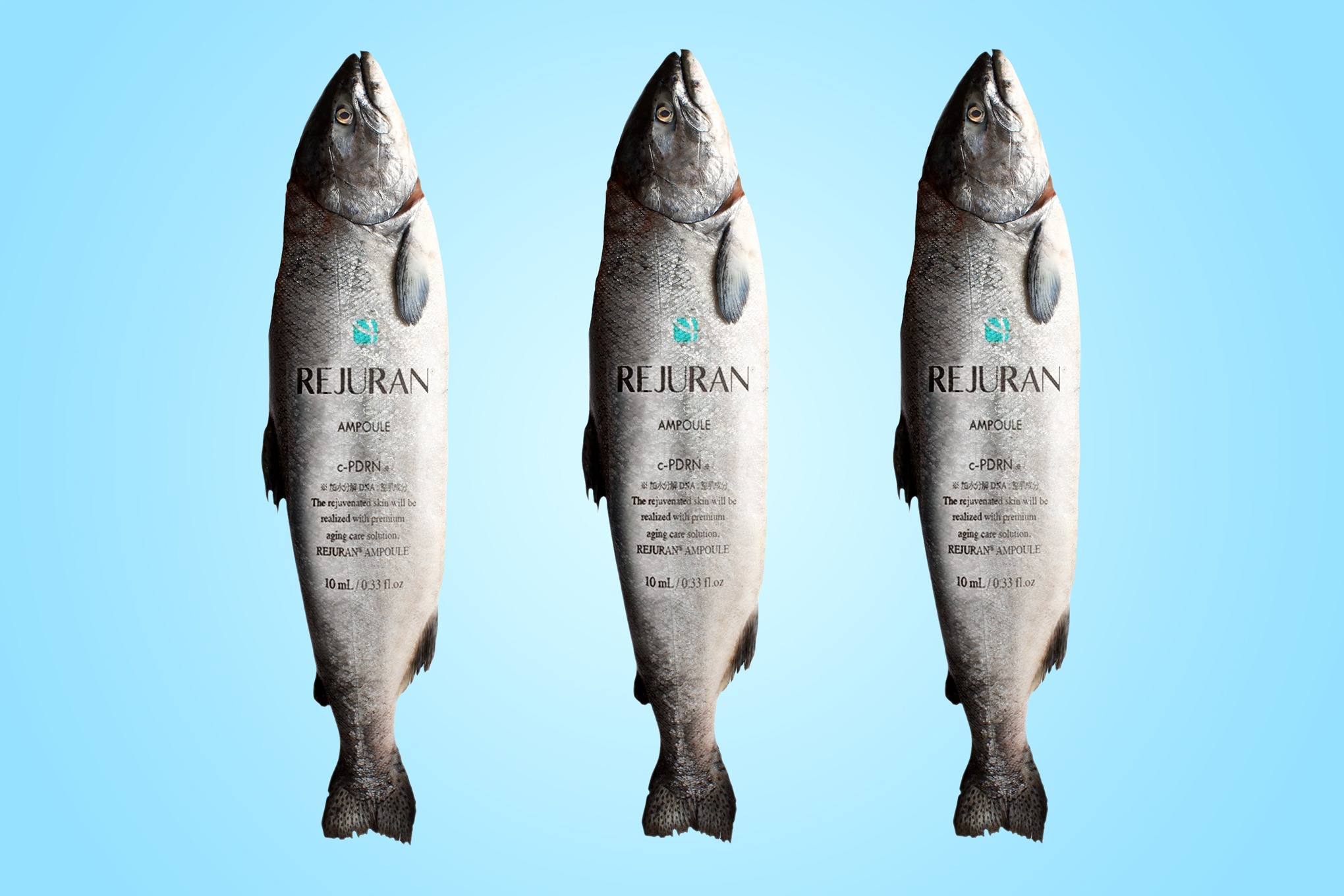 Three silver salmon with the Rejuran bottle on them in front of a blue background