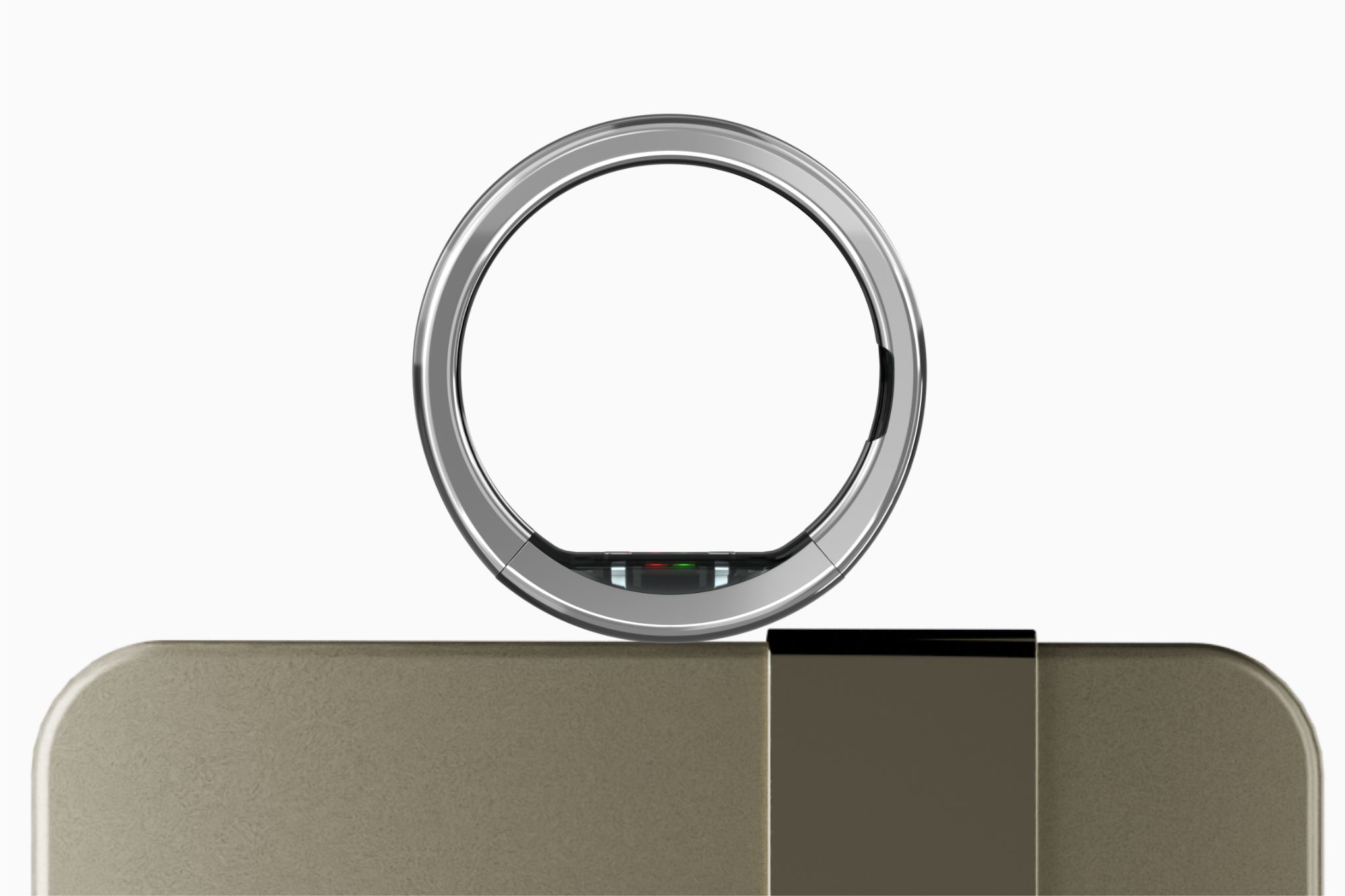 The Ultrahuman Ring Pro, positioned atop its Pro Charging case.