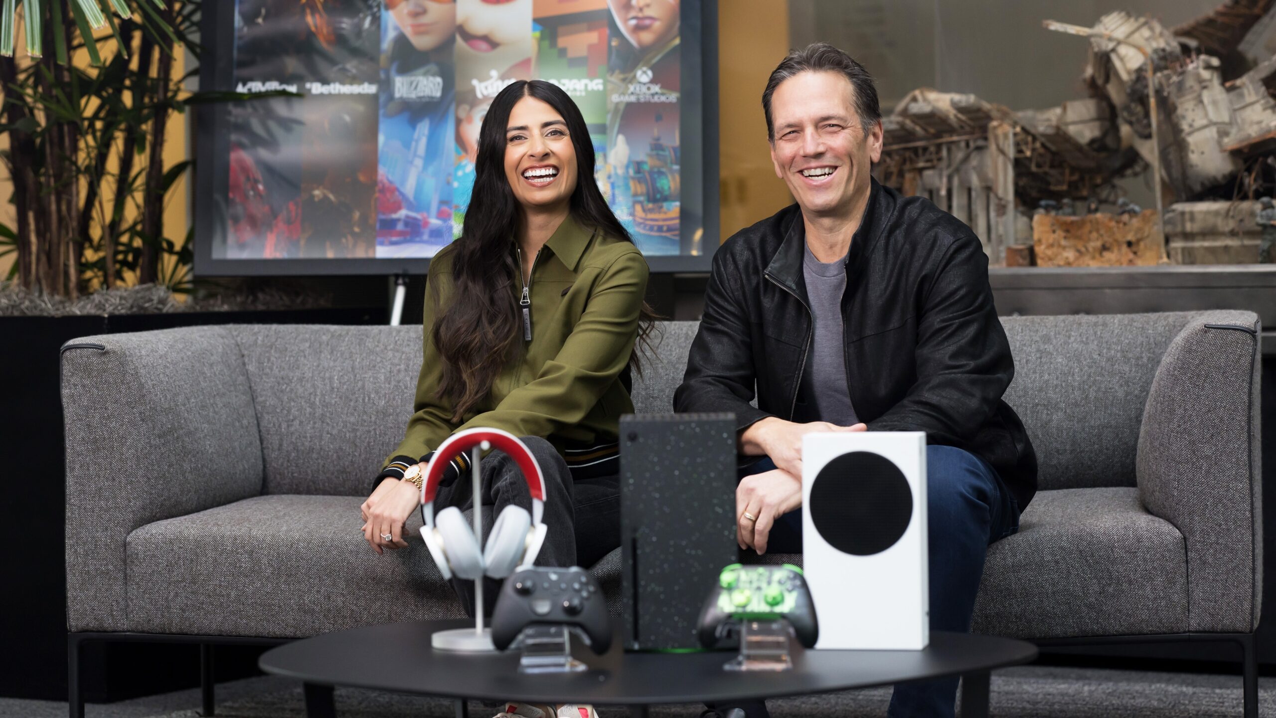 Xbox ex boss Phil Spencer seated on a coach with new Xbox CEO Asha Sharma