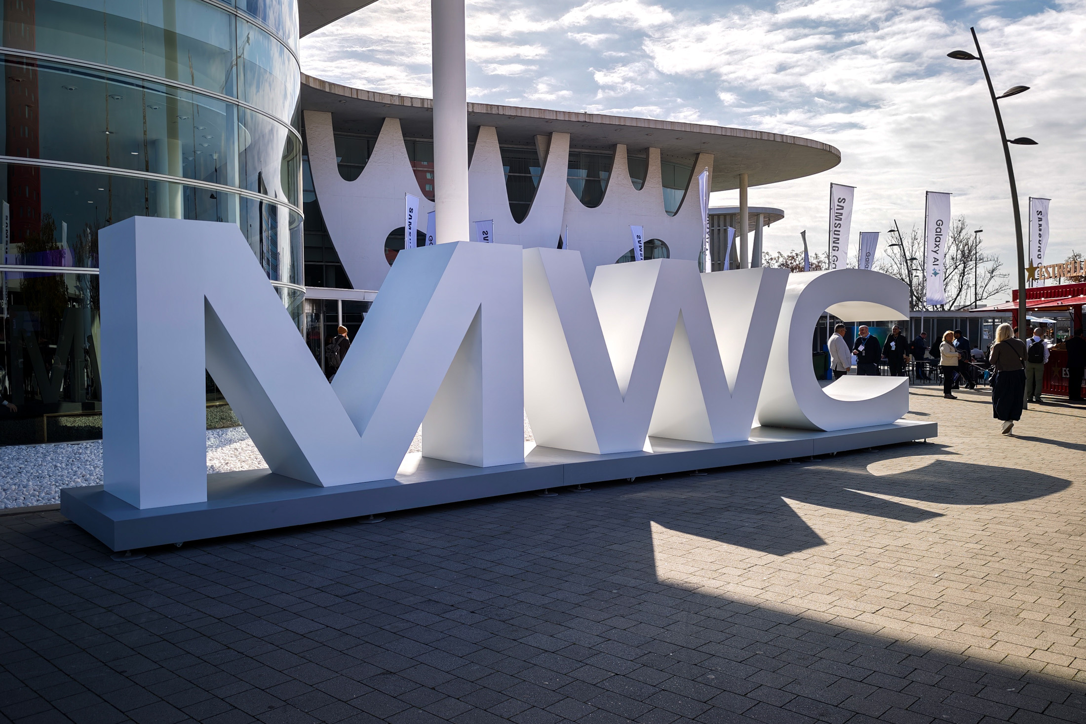 Photo of a large white 'MWC' sign at MWC 2025