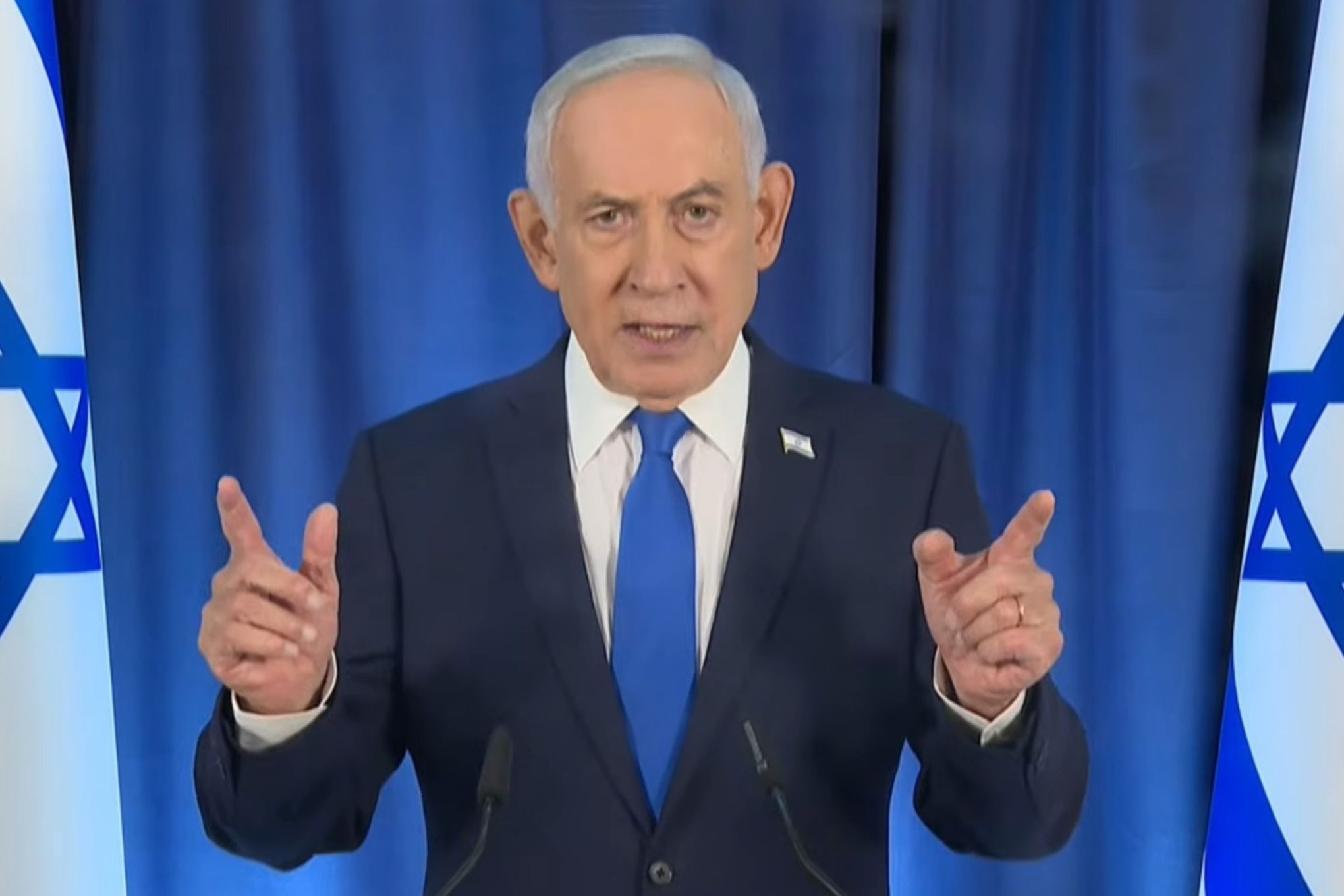 A screenshot of Benjamin Netanyahu during a live press conference broadcast.