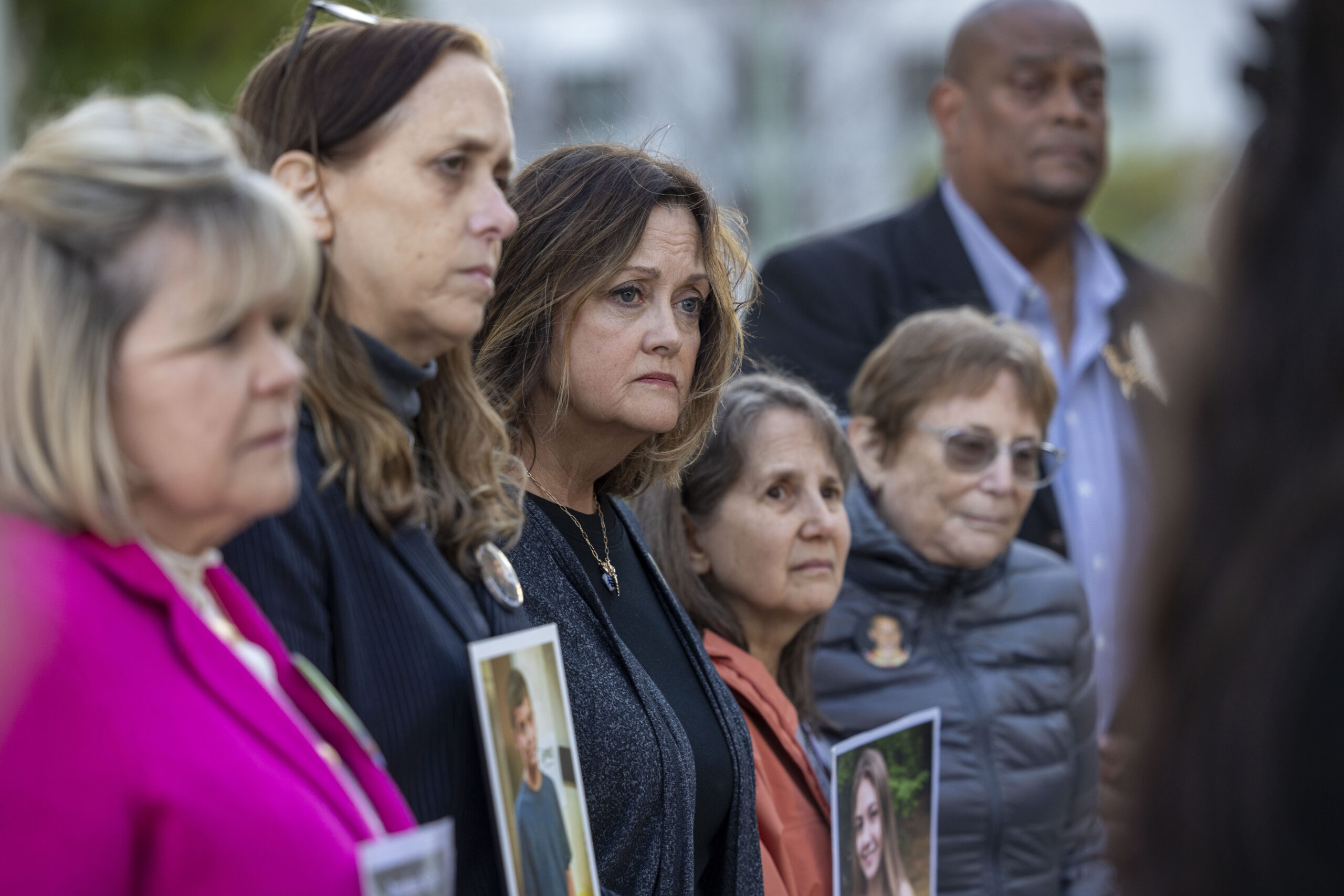 Survivor parents listen as a lawyer speaks to the press outside the Los Angeles Superior Court at United States Court House on February 18, 2026 in Los Angeles, California.