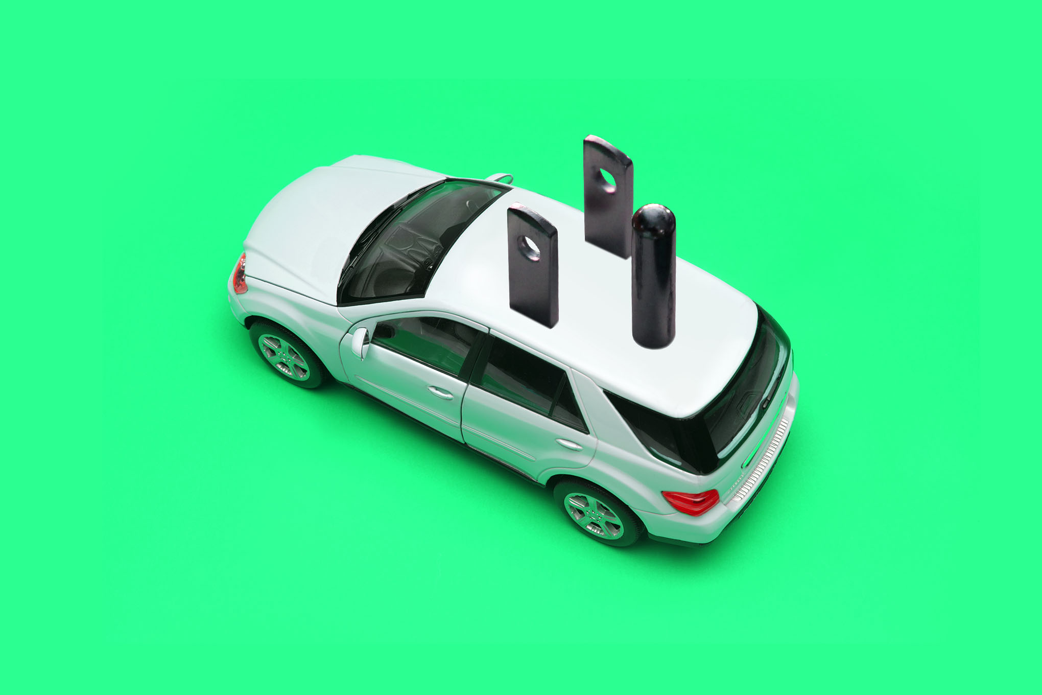 Digital photo collage of battery graphics overlayed on cars.