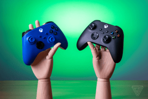 Two wooden hands holding a pair of Xbox Wireless Controllers