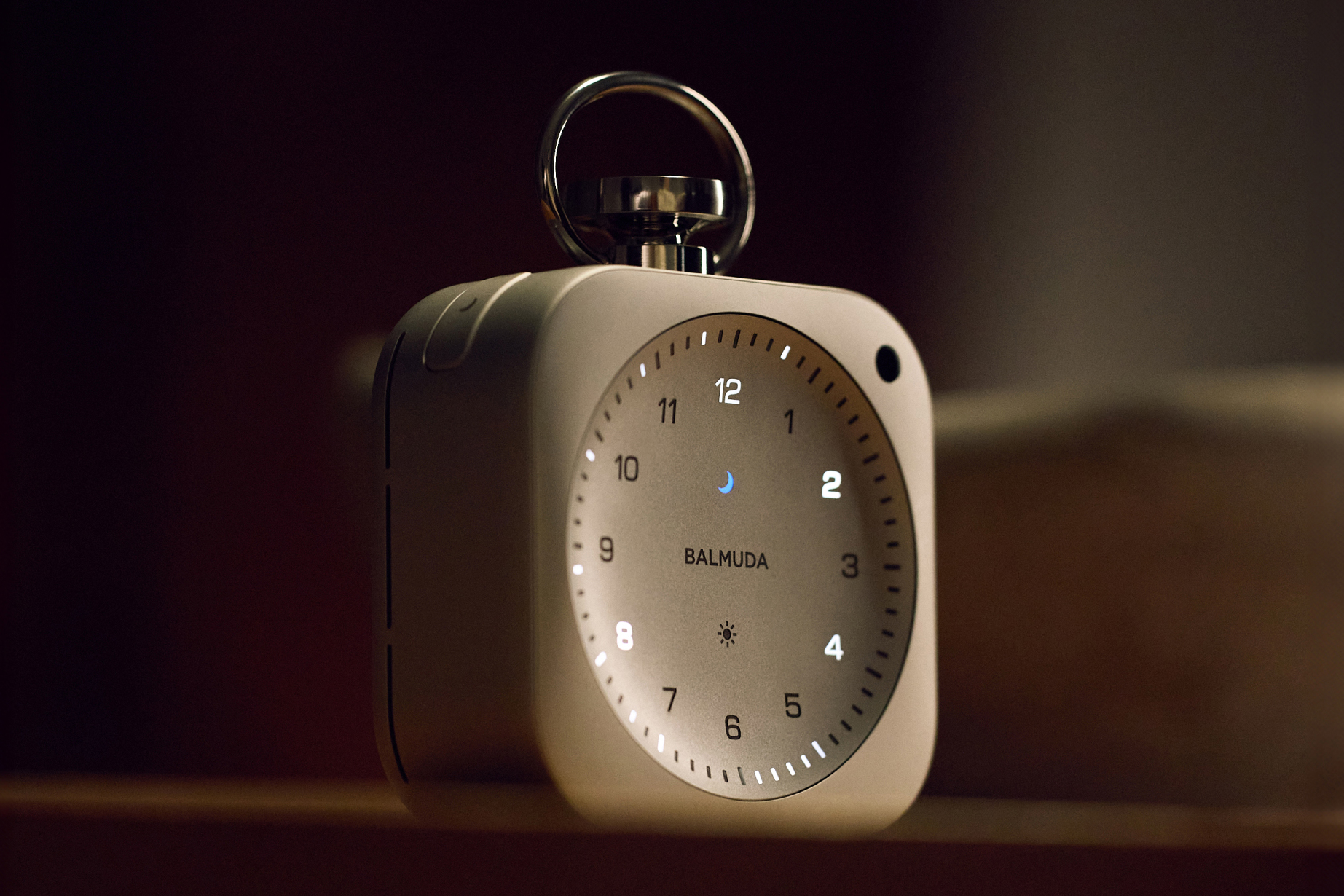 Balmuda’s The Clock in a dark environment showing its glowing features.