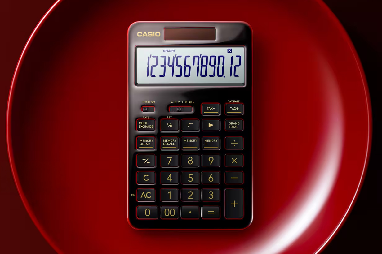 The Casio S100X calculator on a bright red plate.