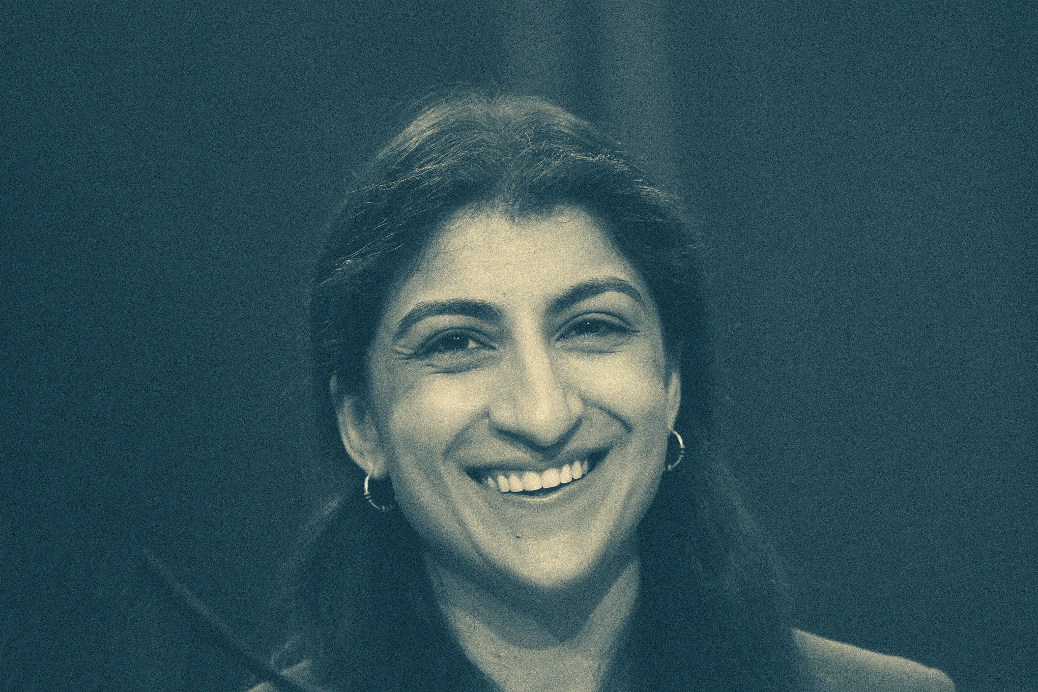 Former FTC Chair Lina Khan with animated sunglasses falling onto her face.