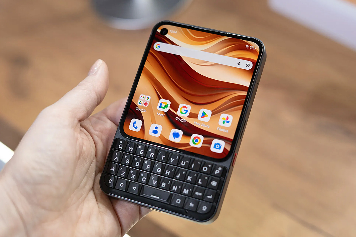 A person holds the black version of the Unihertz Titan 2 Elite in one hand.