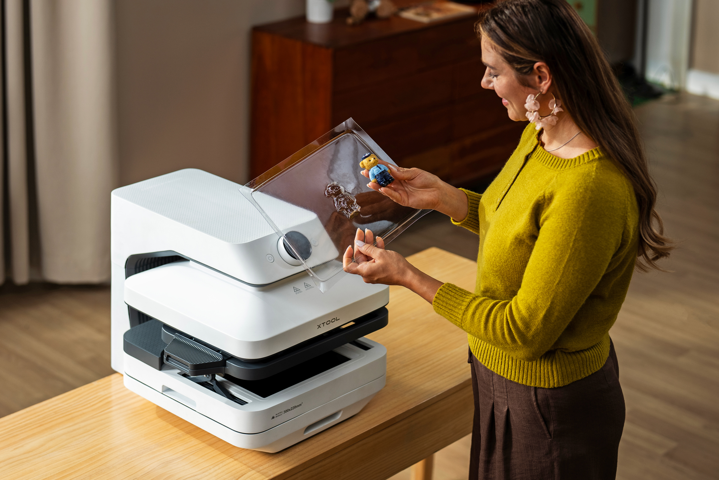 A person holds a plastic mold created with the xTool WonderPress.