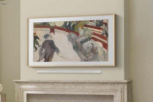 Samsung’s Frame Pro TV wall mounted above a fireplace with a soundbar.