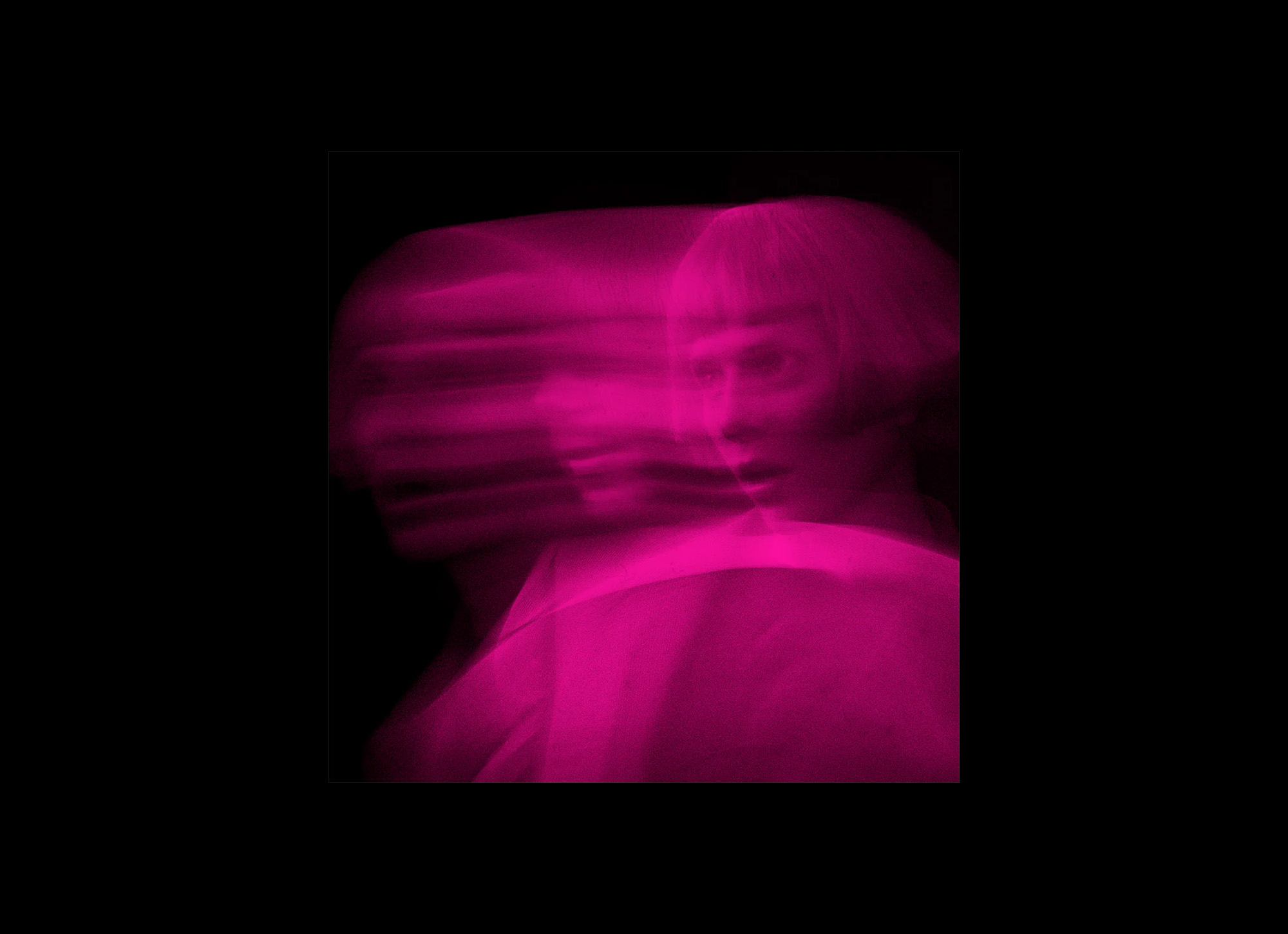 The cover of Tomora’s Come Closer featuring a blurry pink tinged photo of vocalist Aurora in motion.