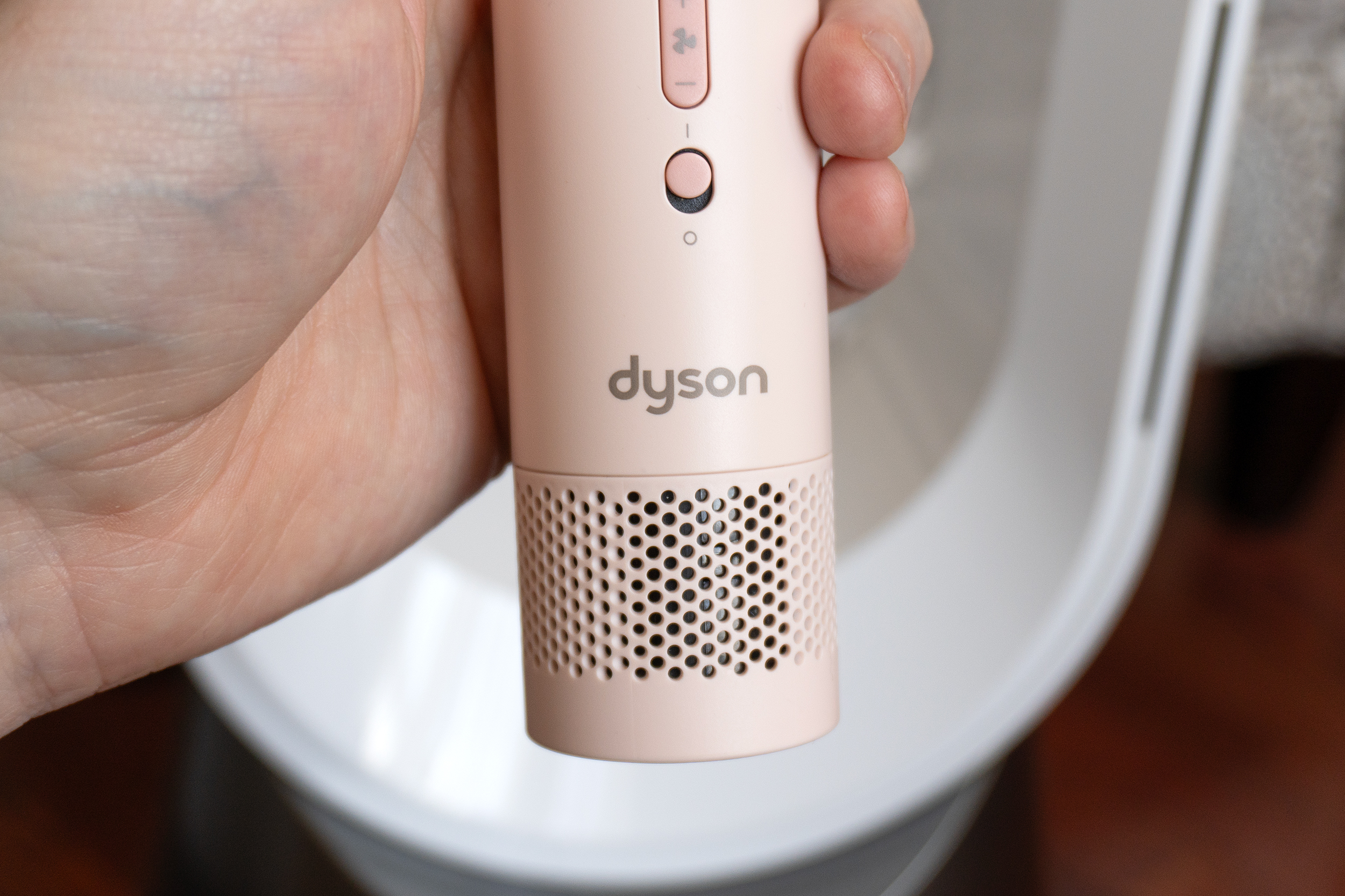 A close-up of the air intake vent on the bottom of the Dyson HushJet Mini Cool fan.