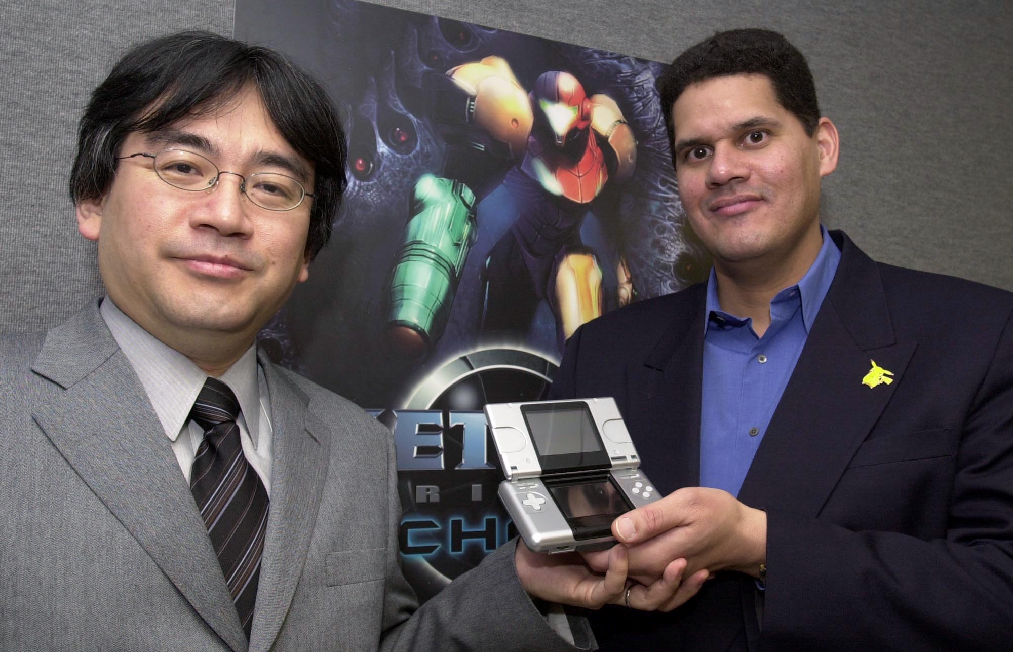 A photo of the late Nintendo president Satoru Iwata and Reggie Fils-Aimé, former president of Nintendo of America, at E3 in 2004