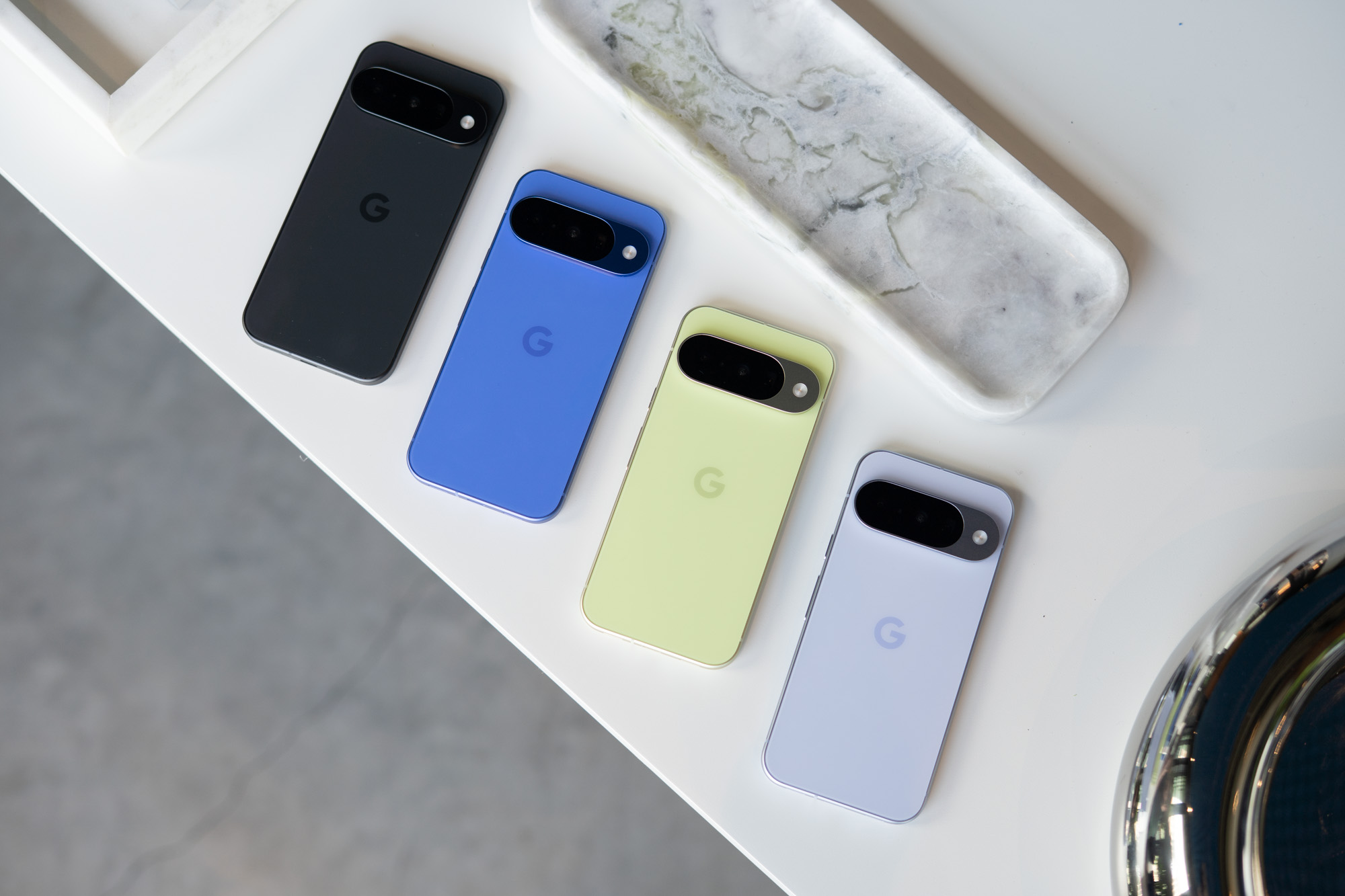 The Google Pixel 10 lineup on a table.