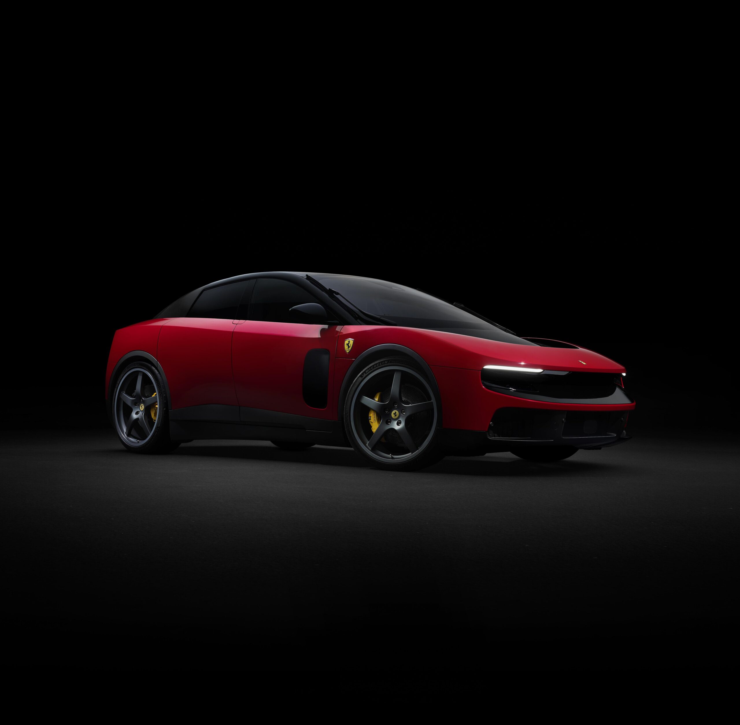 Side thre quarters view of the Ferarri Luce in red