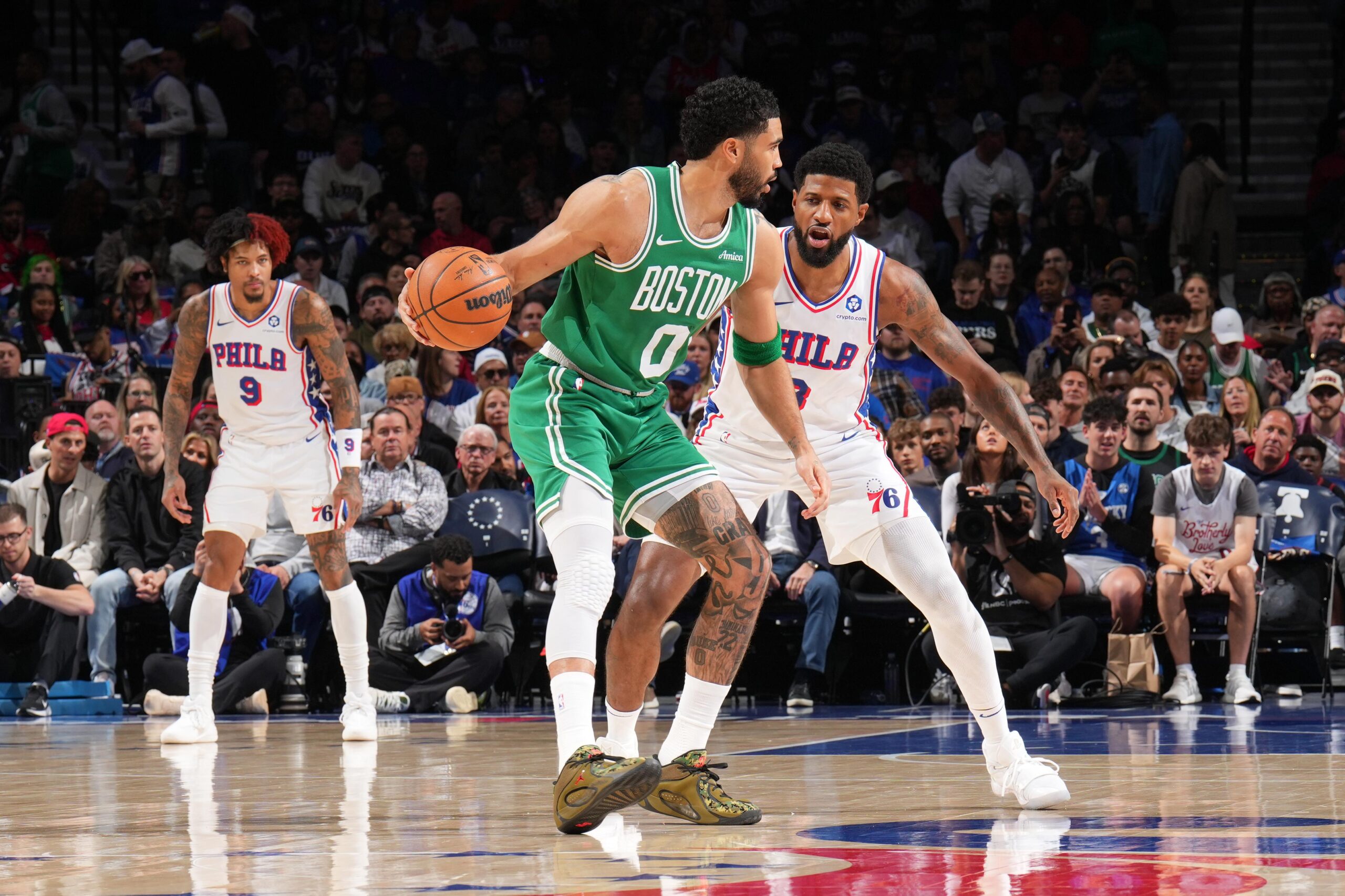 A photo of Paul George of the Philadelphia 76ers guarding Jayson Tatum of the Boston Celtics during the game during Round One Game Six of the 2026 NBA Playoffs.