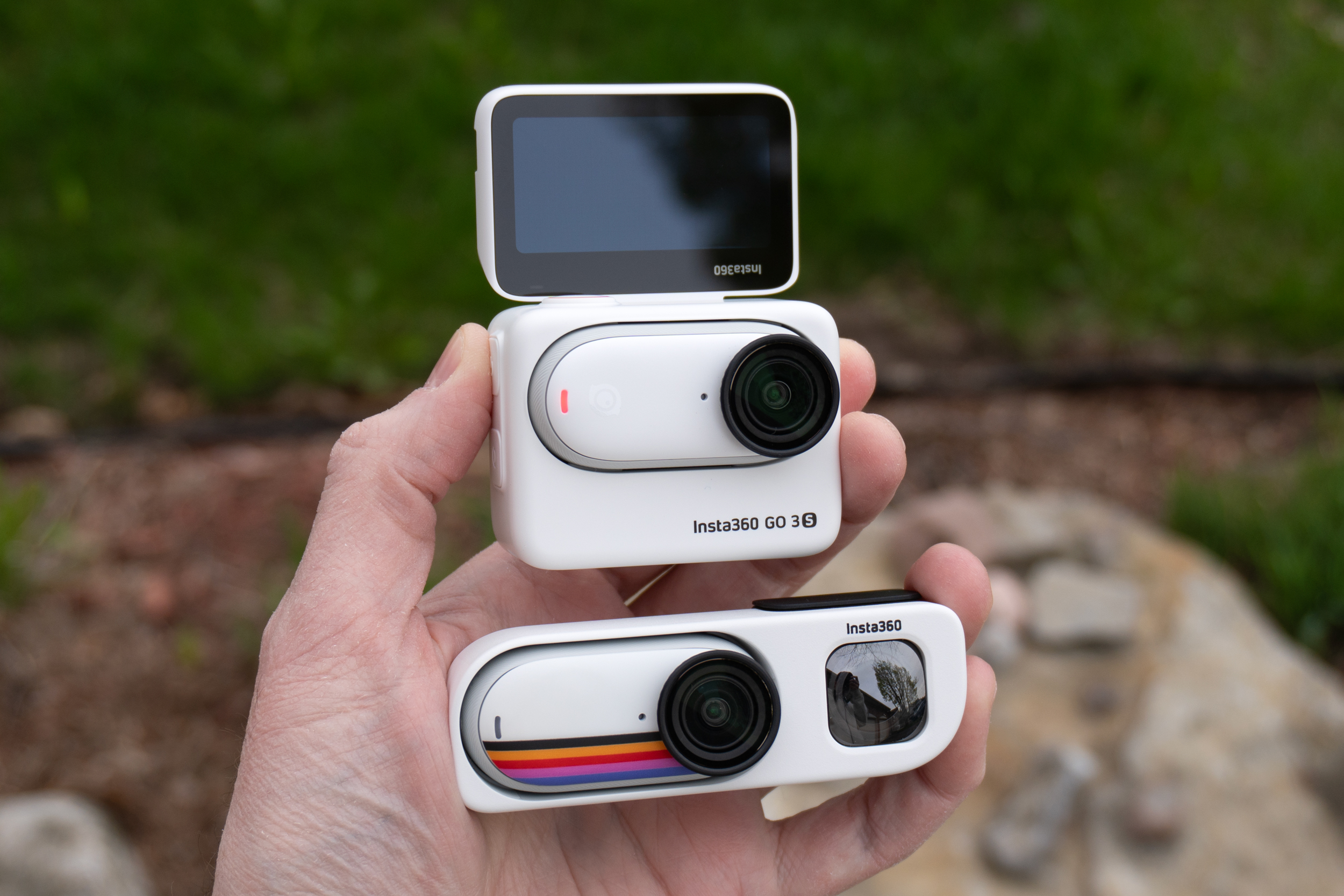 The Insta360 Go 3S in the Retro Viewfinder next to the same camera in the Action Pod accessory. The Insta360 Go 3S in the Retro Viewfinder next to the same camera in the Action Pod accessory.