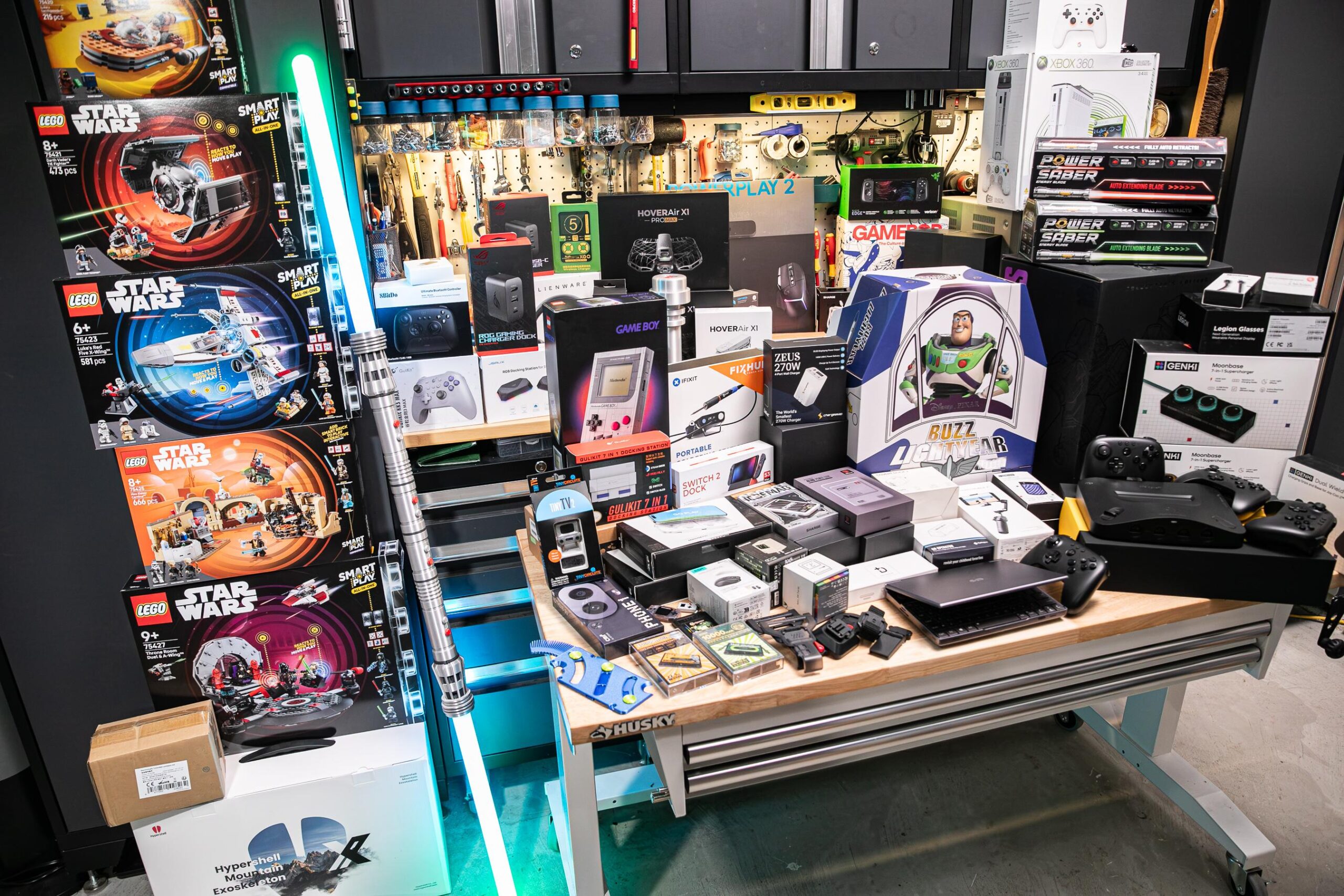 A room full of Lego sets, electronics, and other goodies available for giveaway.