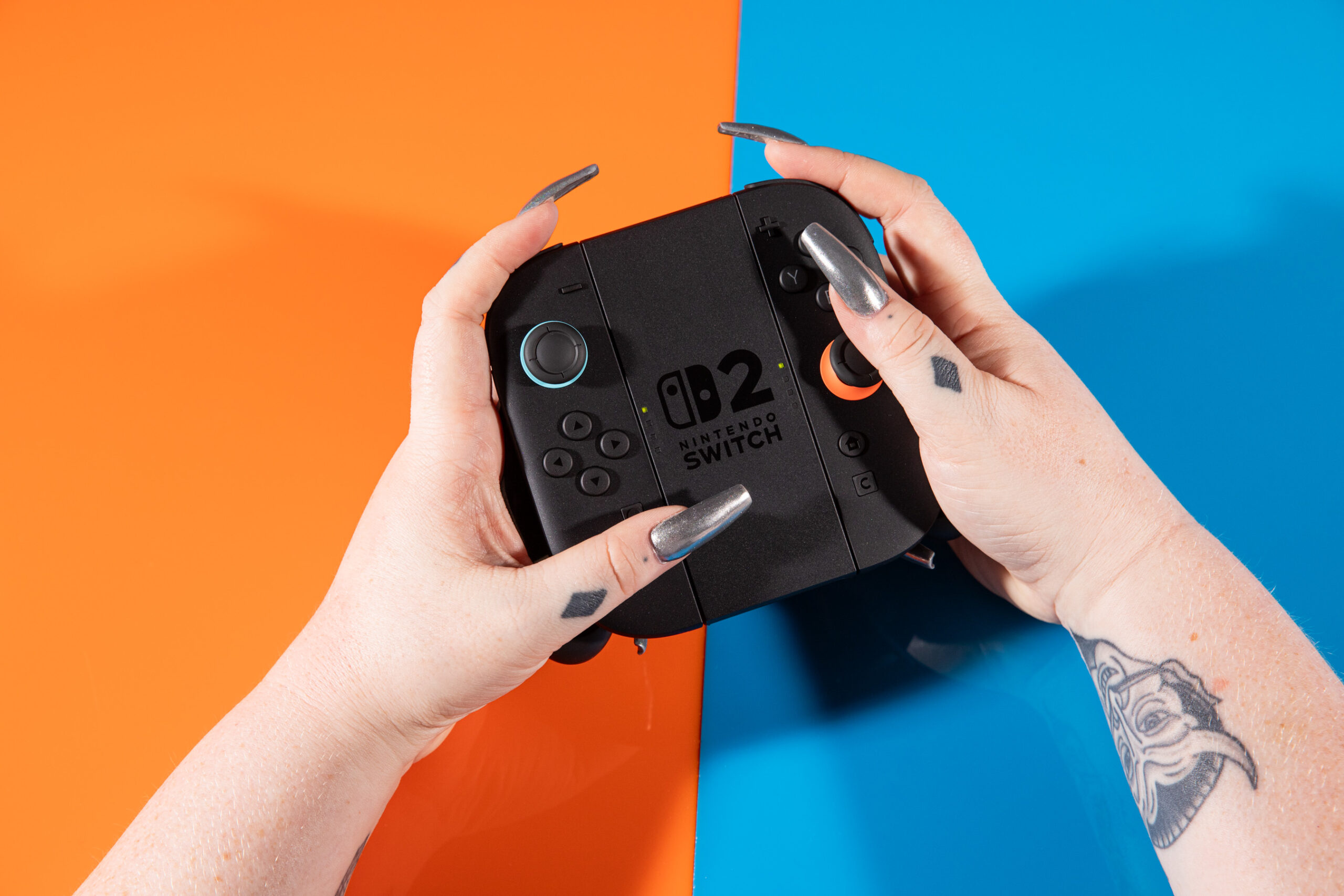 A photo of the Joy-Con 2 controllers for the Nintendo Switch 2, in a controller grip.