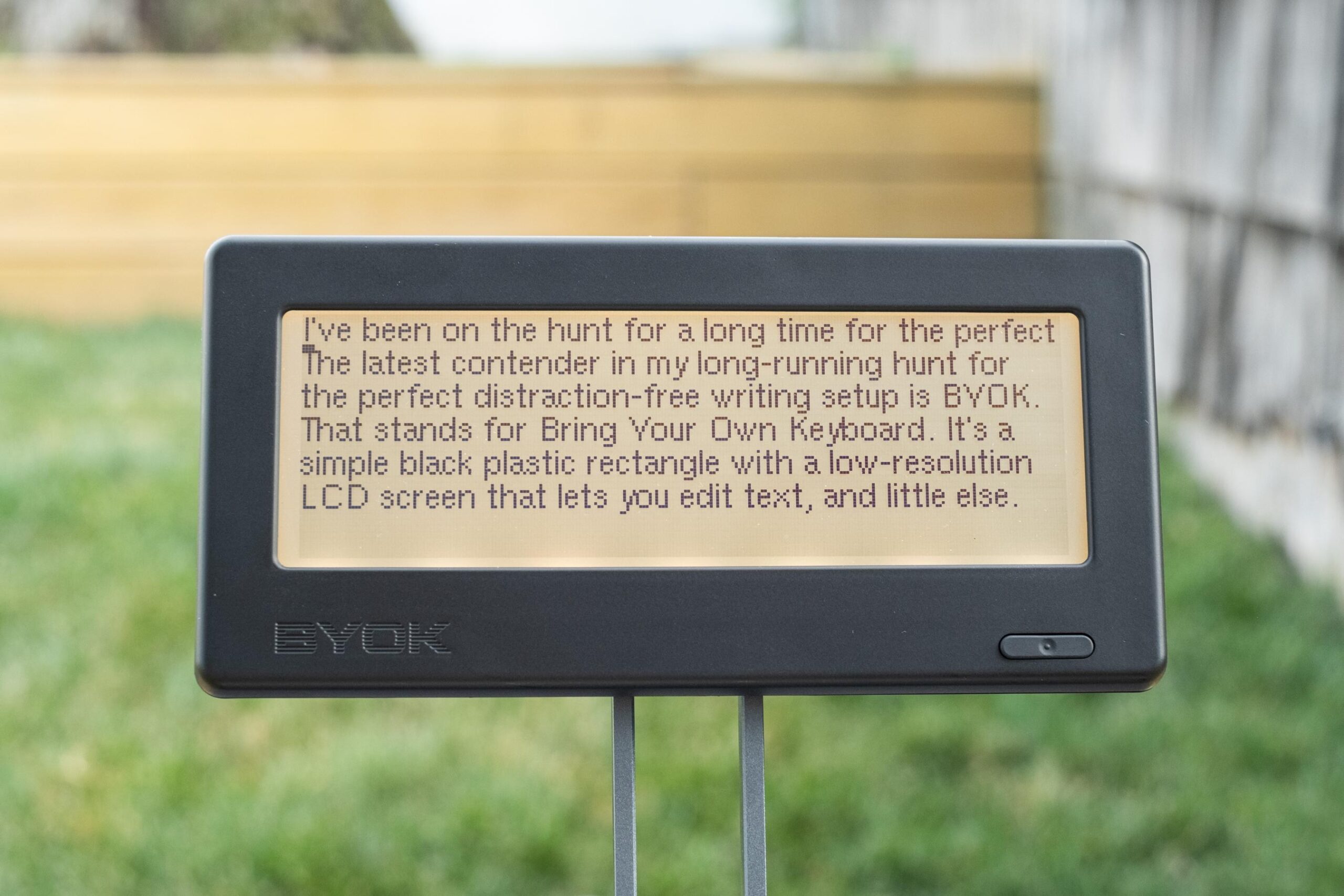 A close up of the BYOK in a backyard showing the intro to this very review.