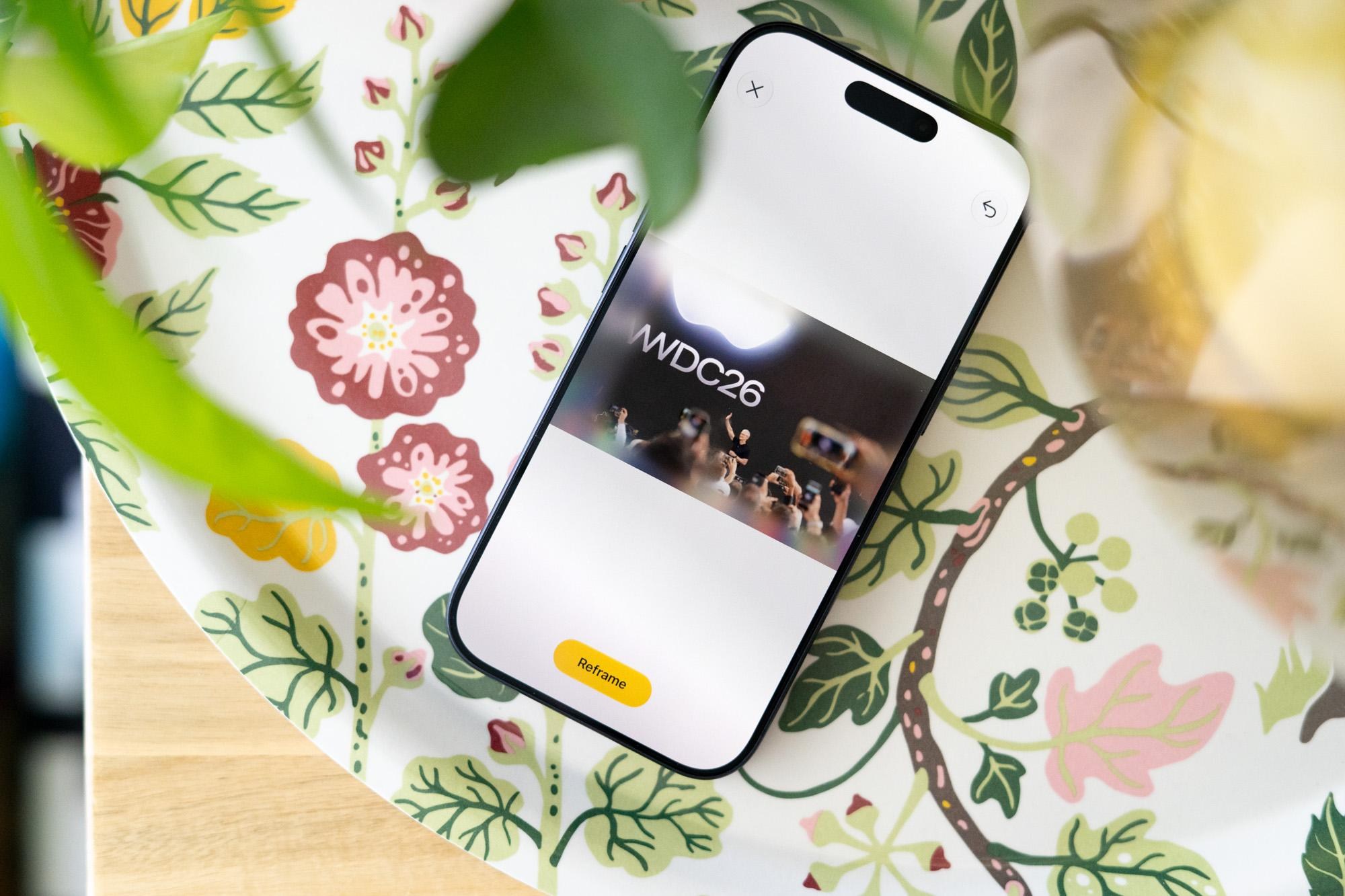 iPhone on a tray showing editing UI in Apple Photos