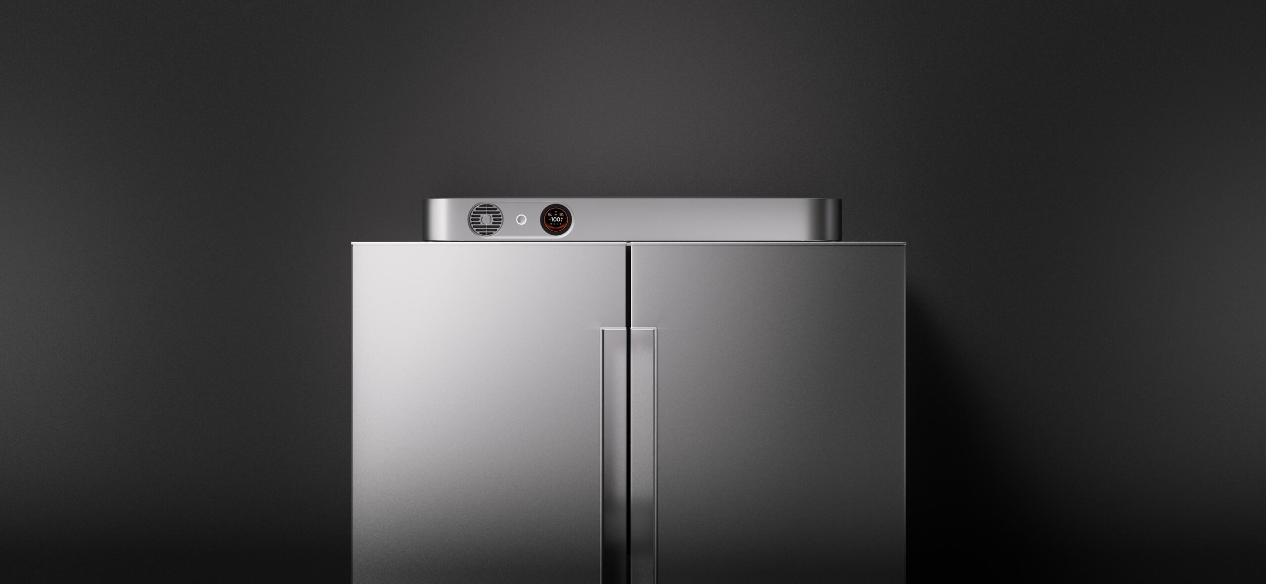 The slim fridgeguard power bank lies sideways on top of a full-sized fridge.