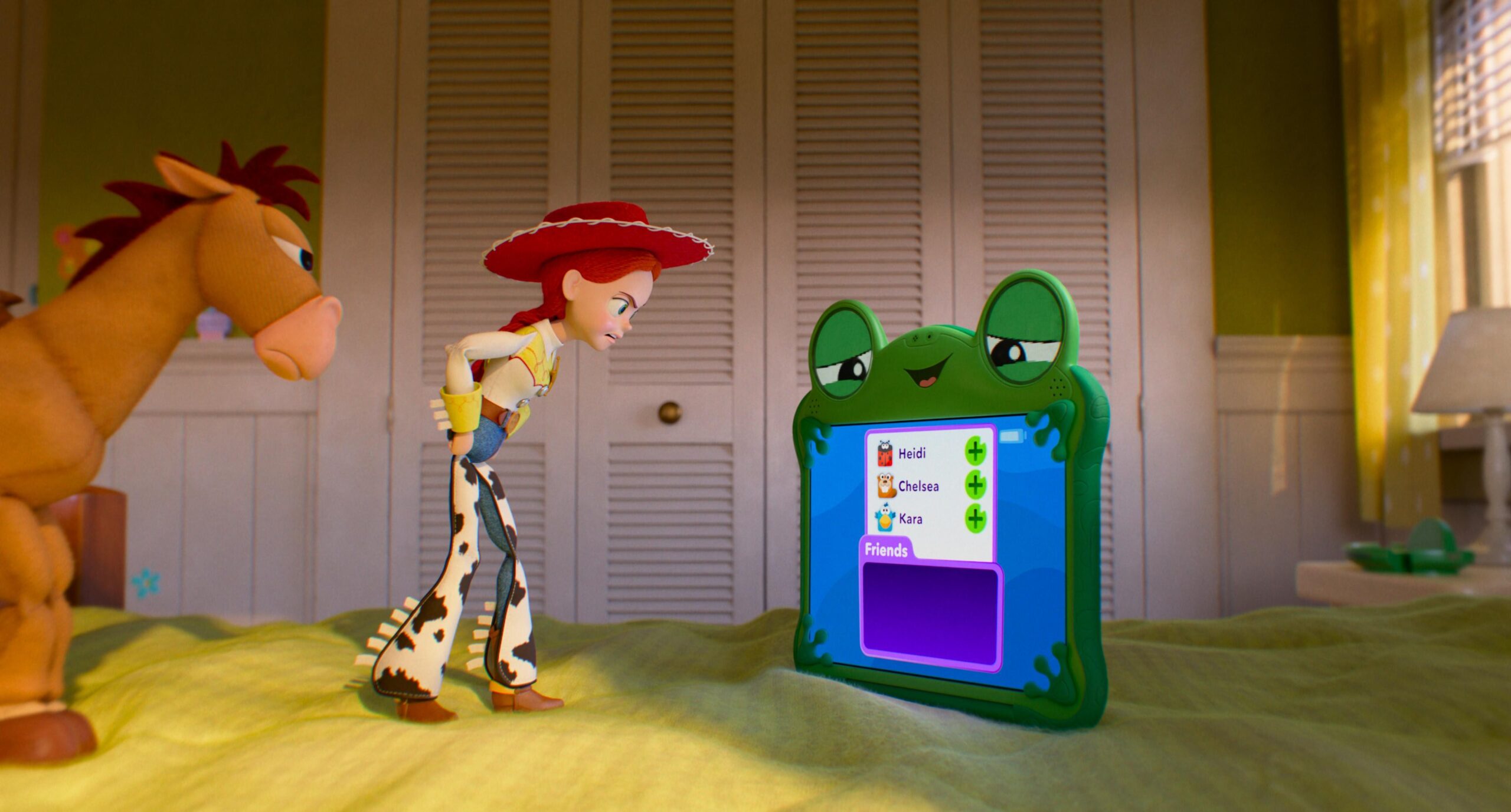 A CGI image of a toy horse and a toy cowgirl<br> looking angrily at a frog-themed tablet.