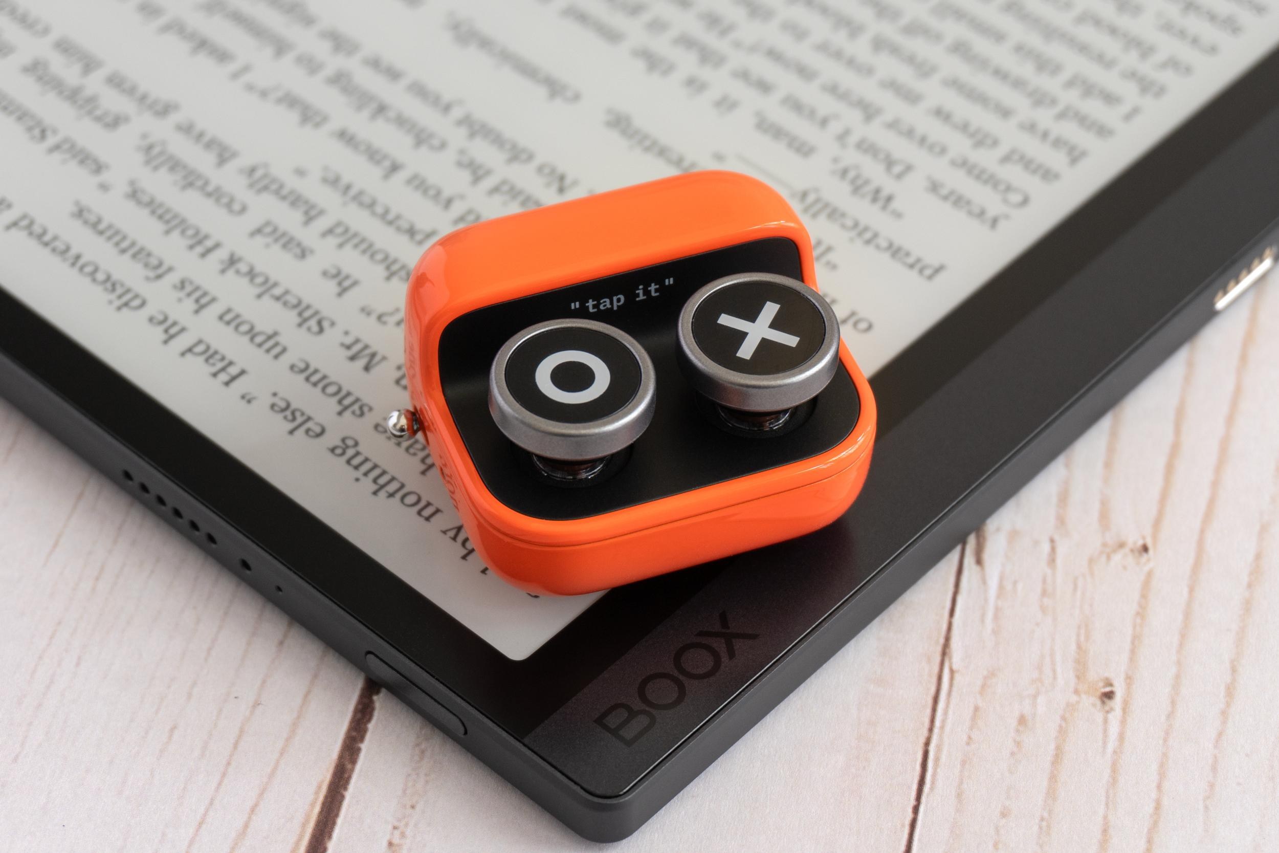 The Boox Tappy wireless page-turning remote on top of one of the company’s E Ink tablets.