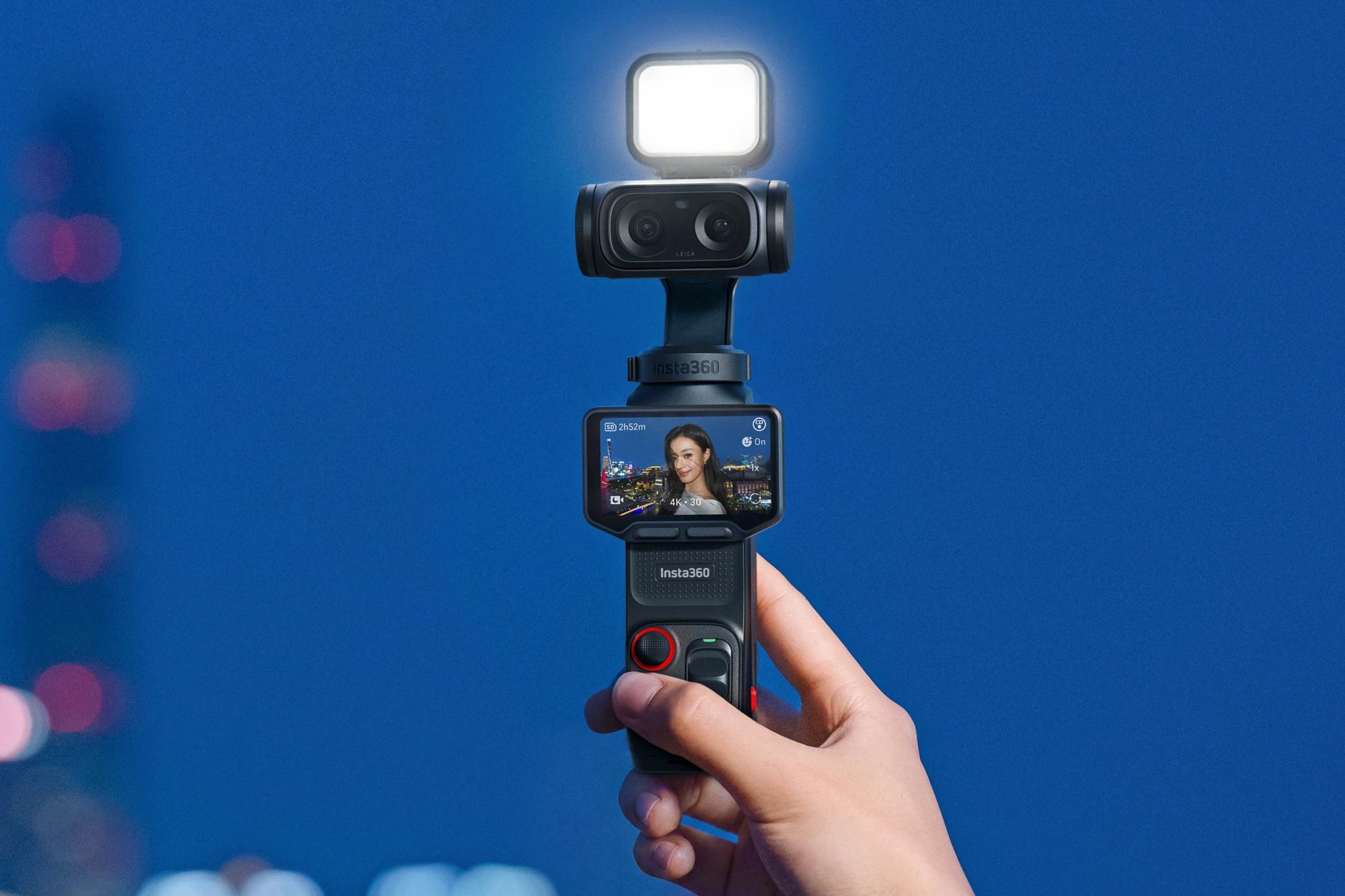 A person films themselves using the Insta360 Luna Ultra camera with a video light attached.