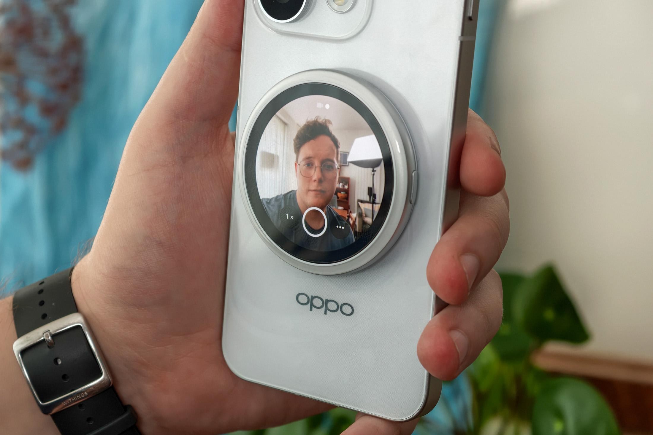 Photo of Oppo Bubble attached to a Reno 16 Pro taking a selfie