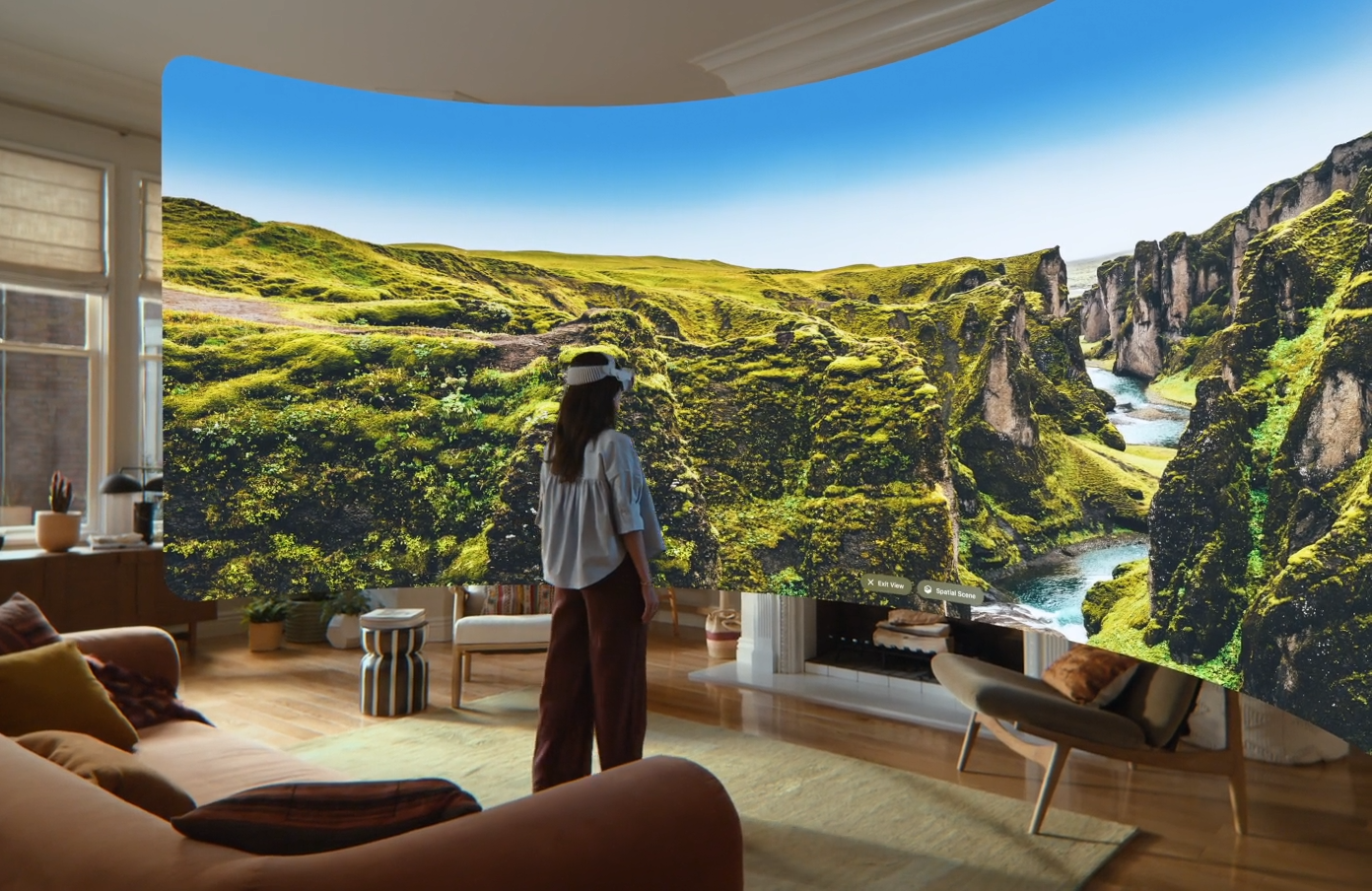 A woman wearing a Apple Vision Pro headset while looking at a panorama