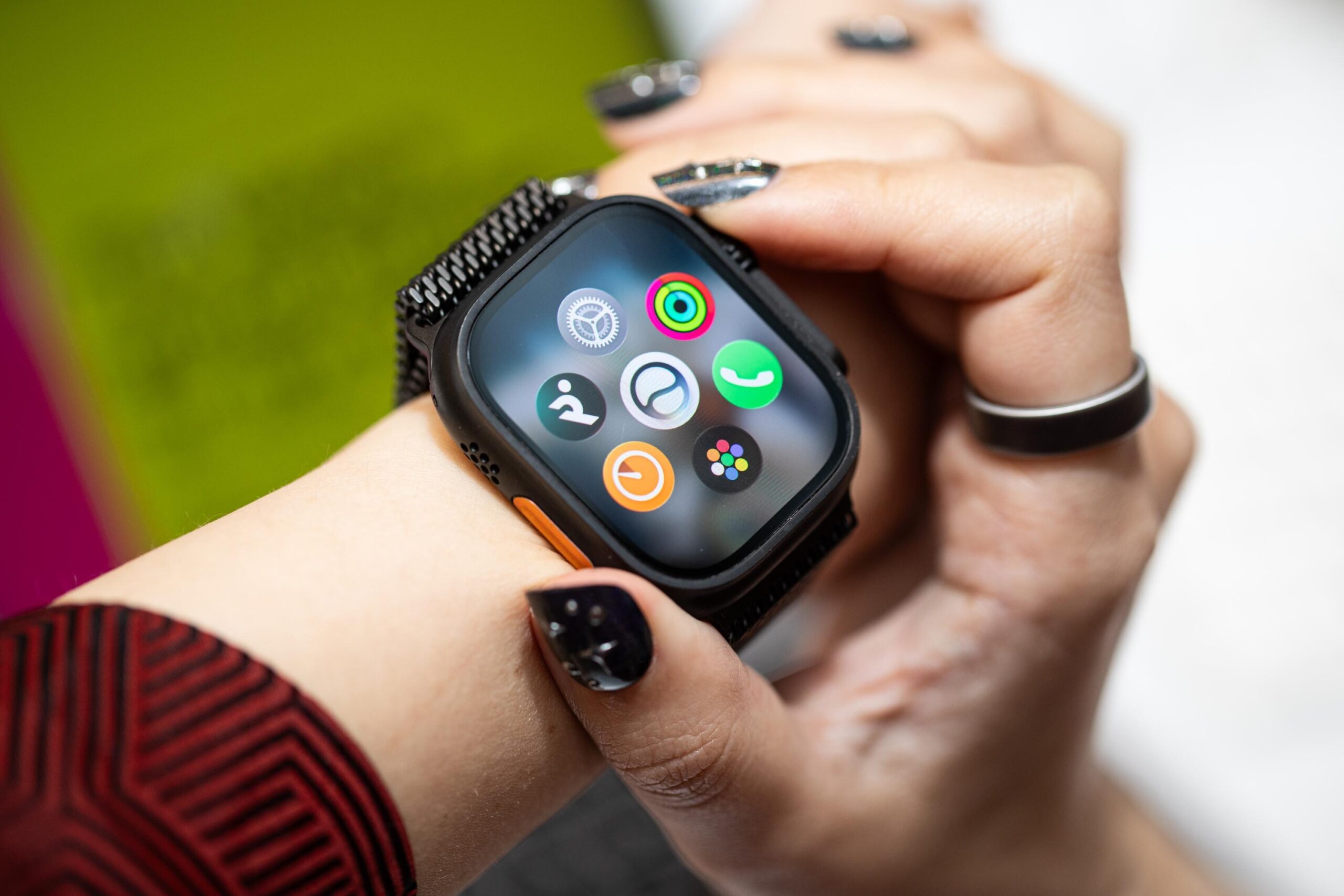 Top-down view of Apple Watch Ultra 3 with the new app launcher in watchOS 27 showing the Siri AI app in the middle.