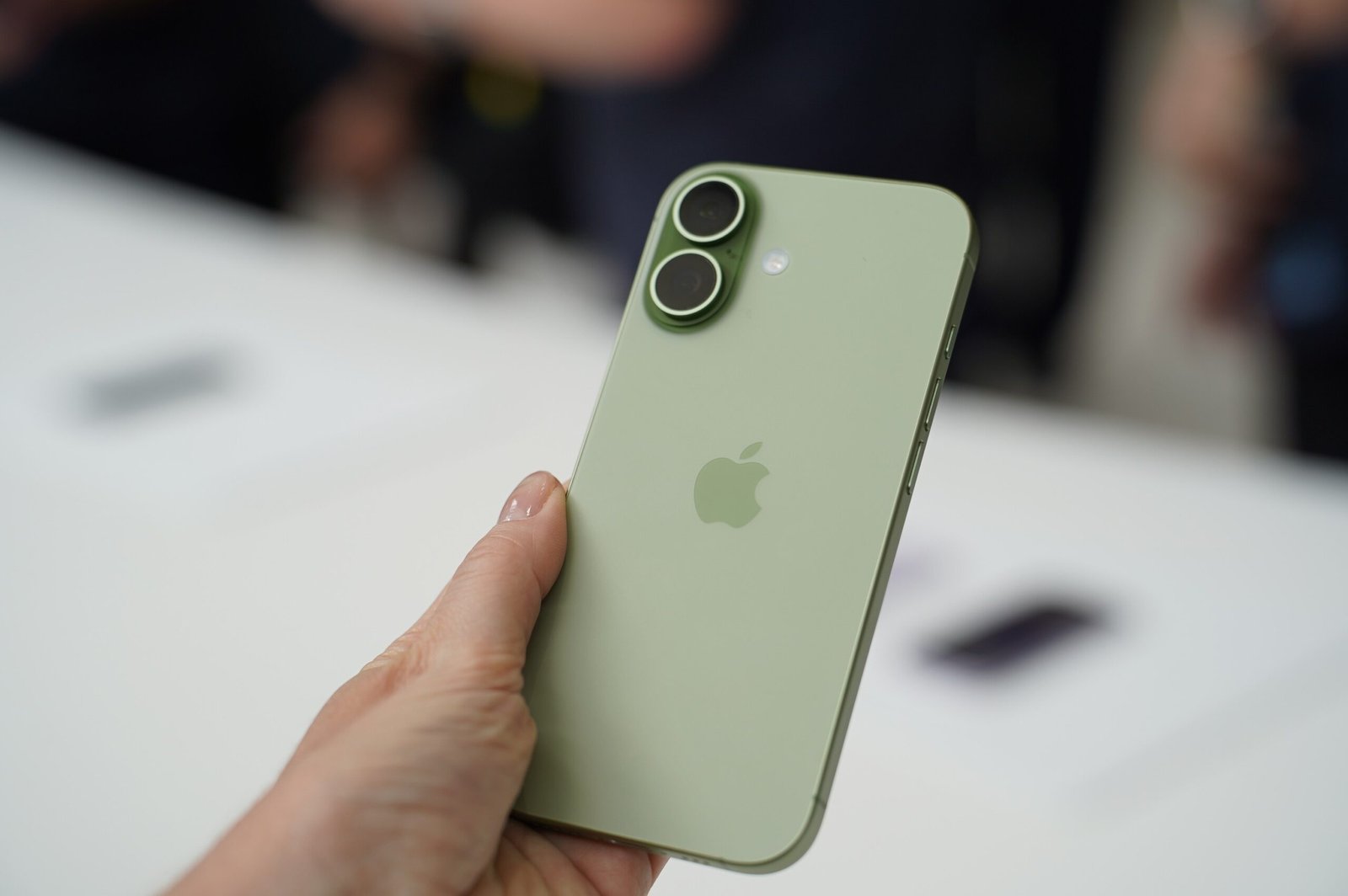 A photo of a person holding the iPhone 17.