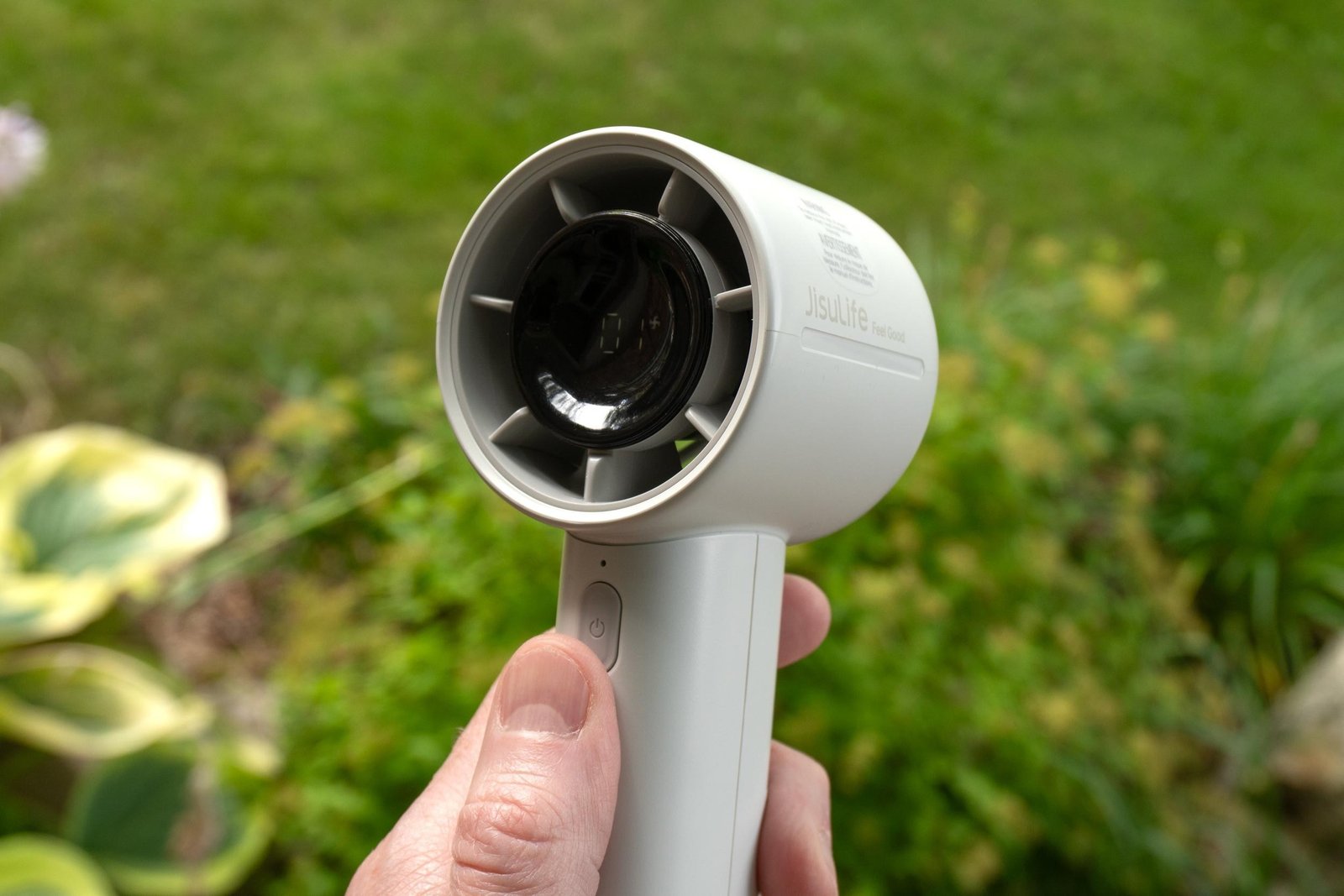 A person holding the JisuLife Life10 S handheld fan.