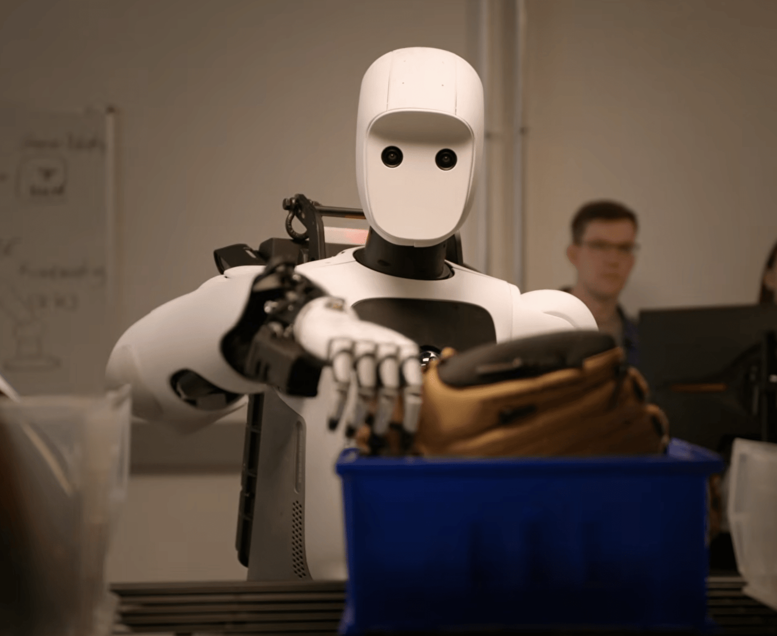 An image of Apptronik’s Apollo 2 robot taking a baseball glove off of a shelf