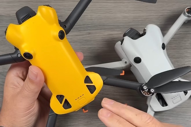 Two drones, one yellow, one grey, almost identical otherwise.