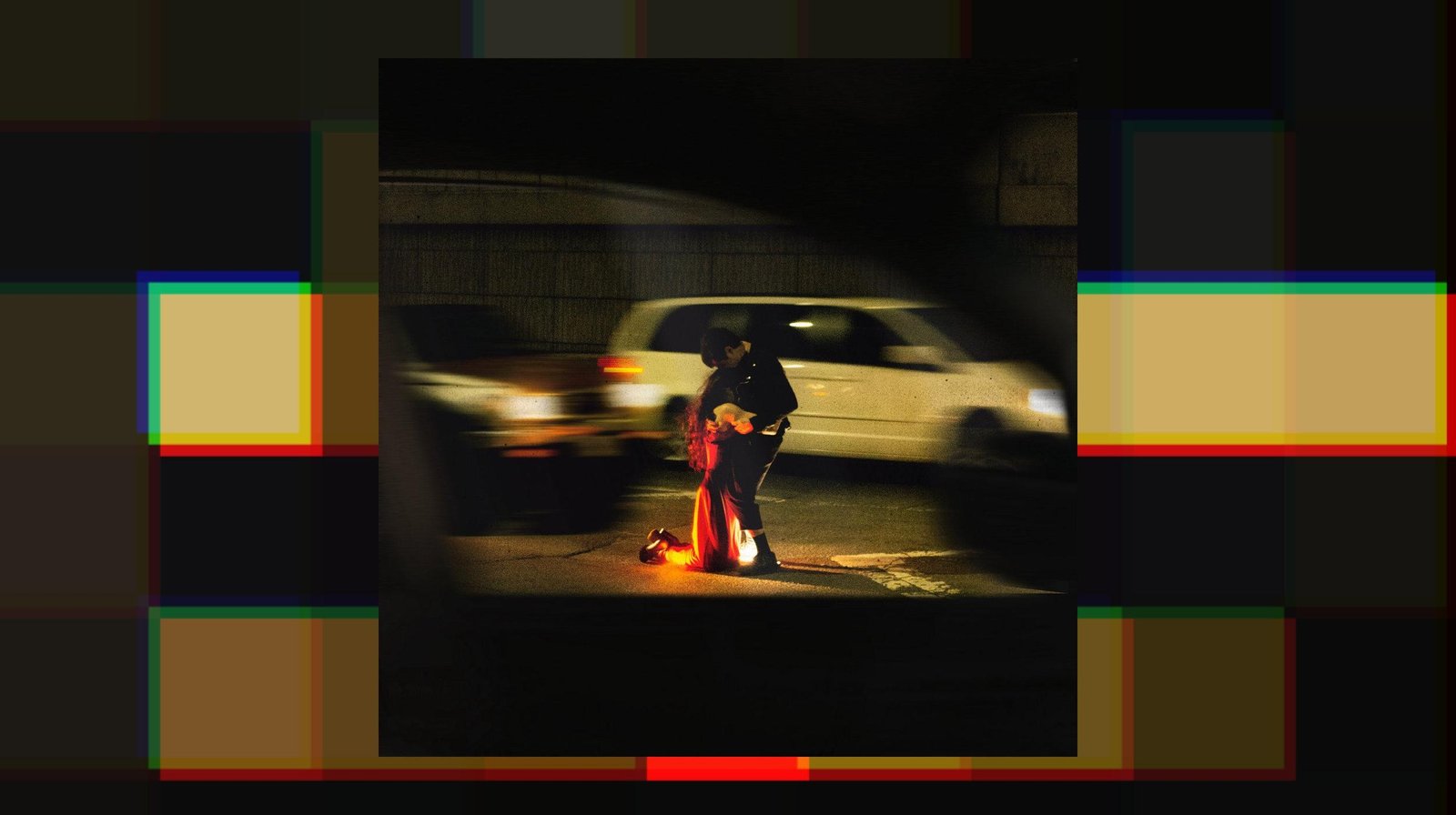 The cover of Rachika Nayar’s Heaven Comes Crashing featuring a woman on her knees hugging a man in the street.