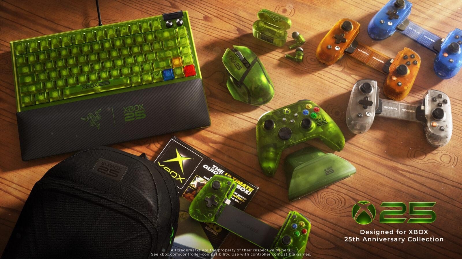 Devices from the Xbox 25th anniversary collection on a wood table
