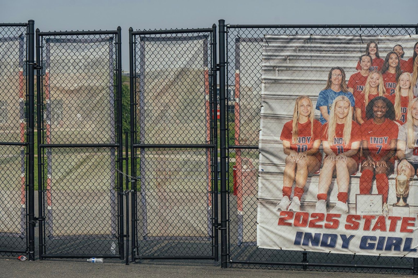A poster of a girls’ team hangs on a fence at a field of a Loudoun County public high school. A poster of a girls’ team hangs on a fence at a field of a Loudoun County public high school.