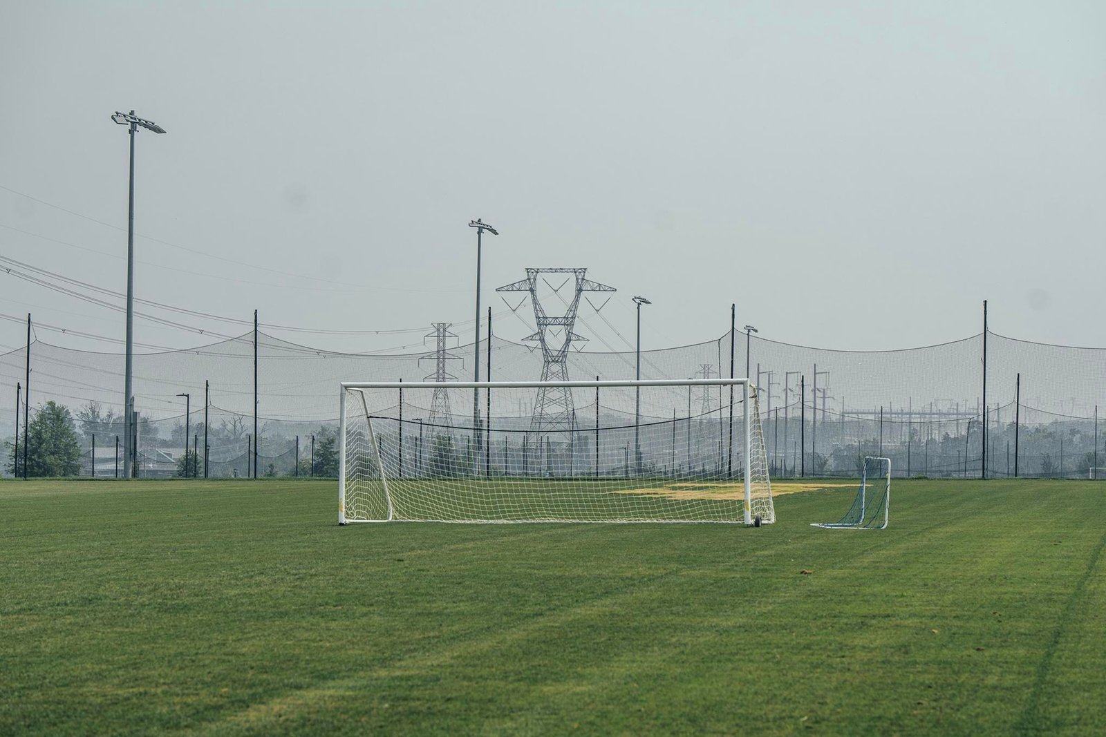 A soccer goal post at Hal and Berni Hanson Regional Park with transmission towers in the background. A soccer goal post at Hal and Berni Hanson Regional Park with transmission towers in the background.