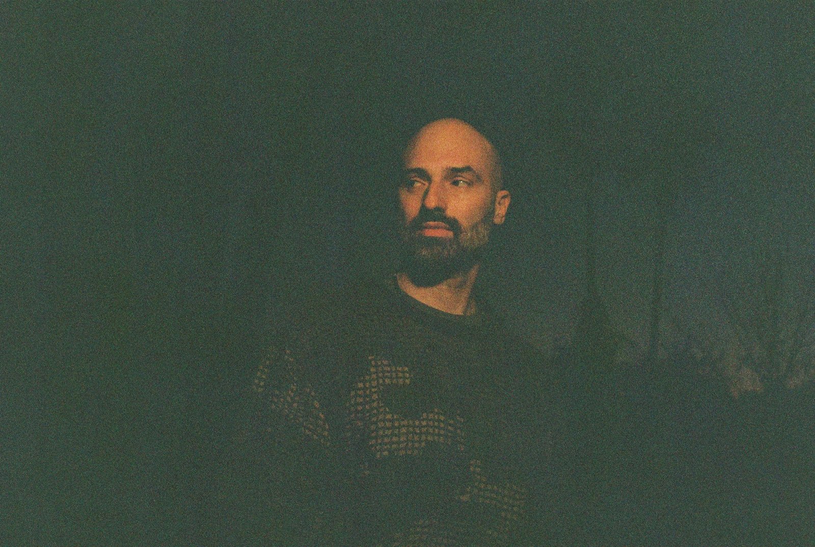 Decap in a lowlight photo that appears to be taken on film.