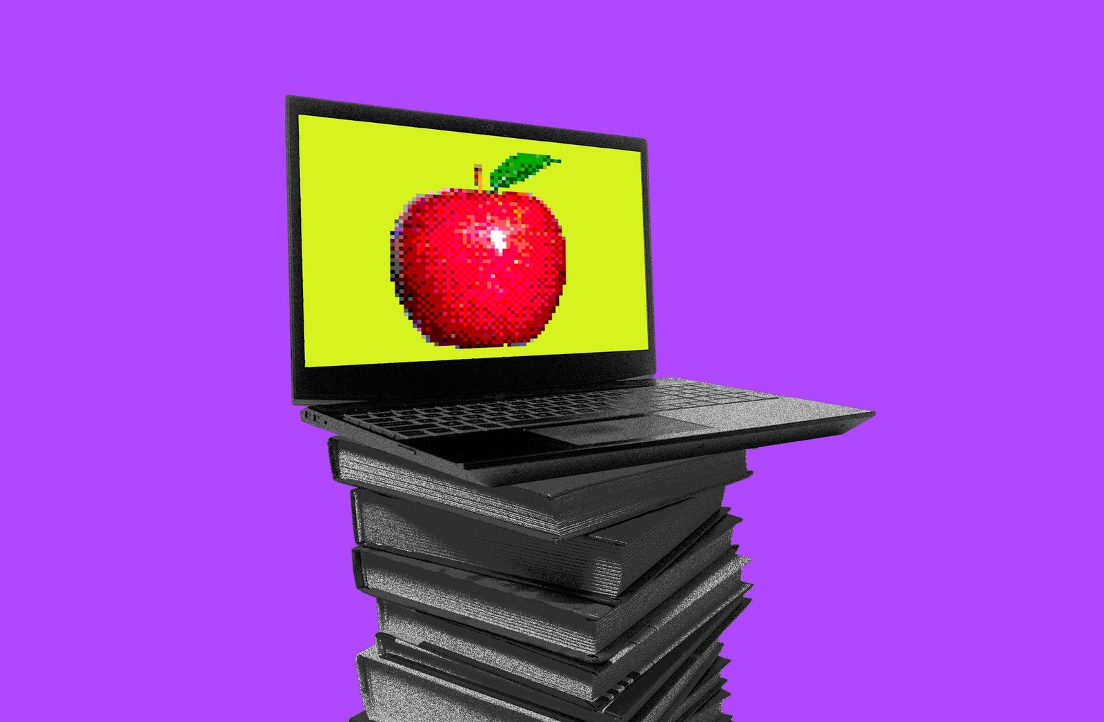 laptop with an apple on a stack of books