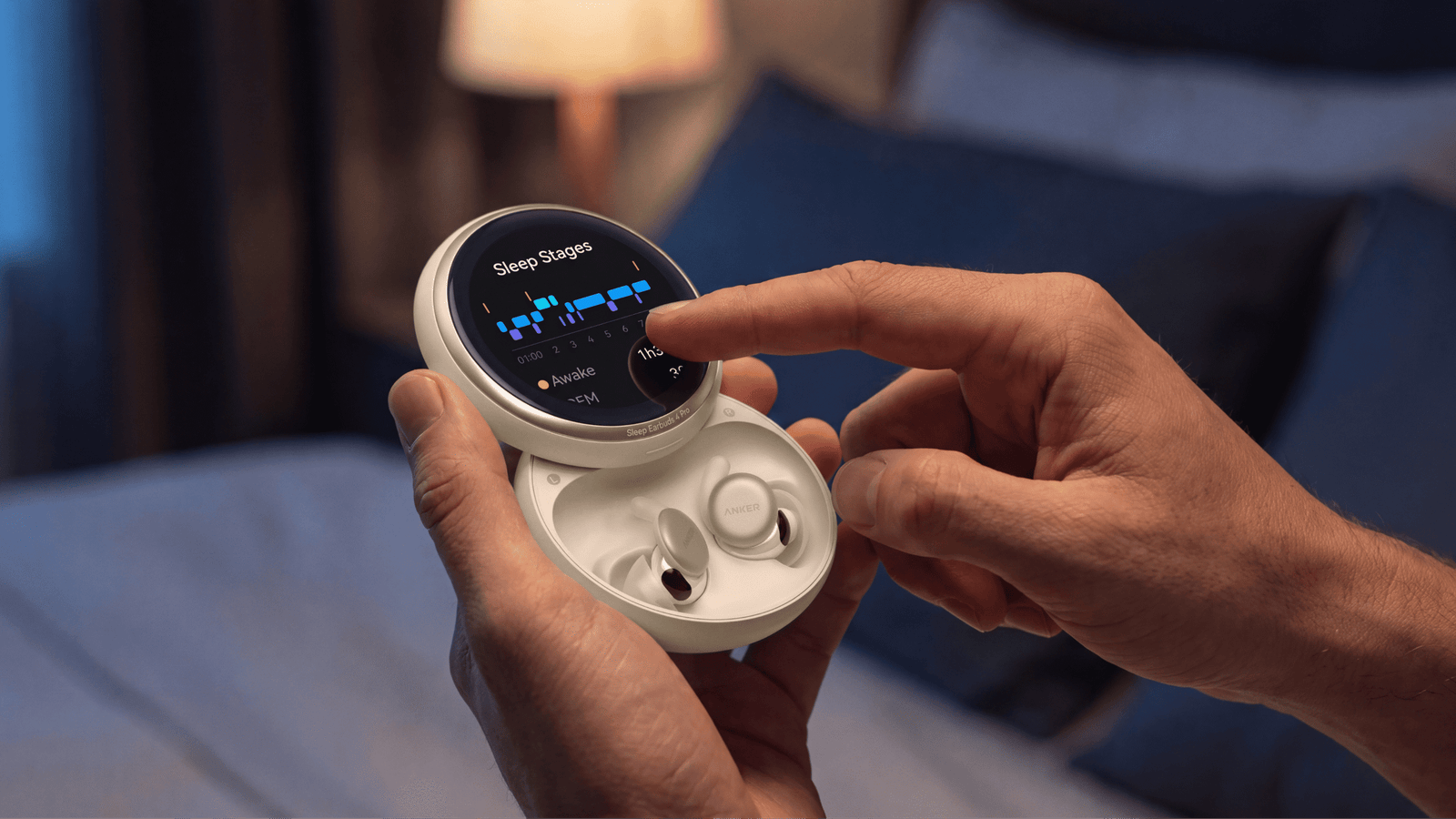 an earbud charging case with a screen on it, slid open to show the white earbuds charging inside. Someone is holding the case in one hand and tapping the screen with the other