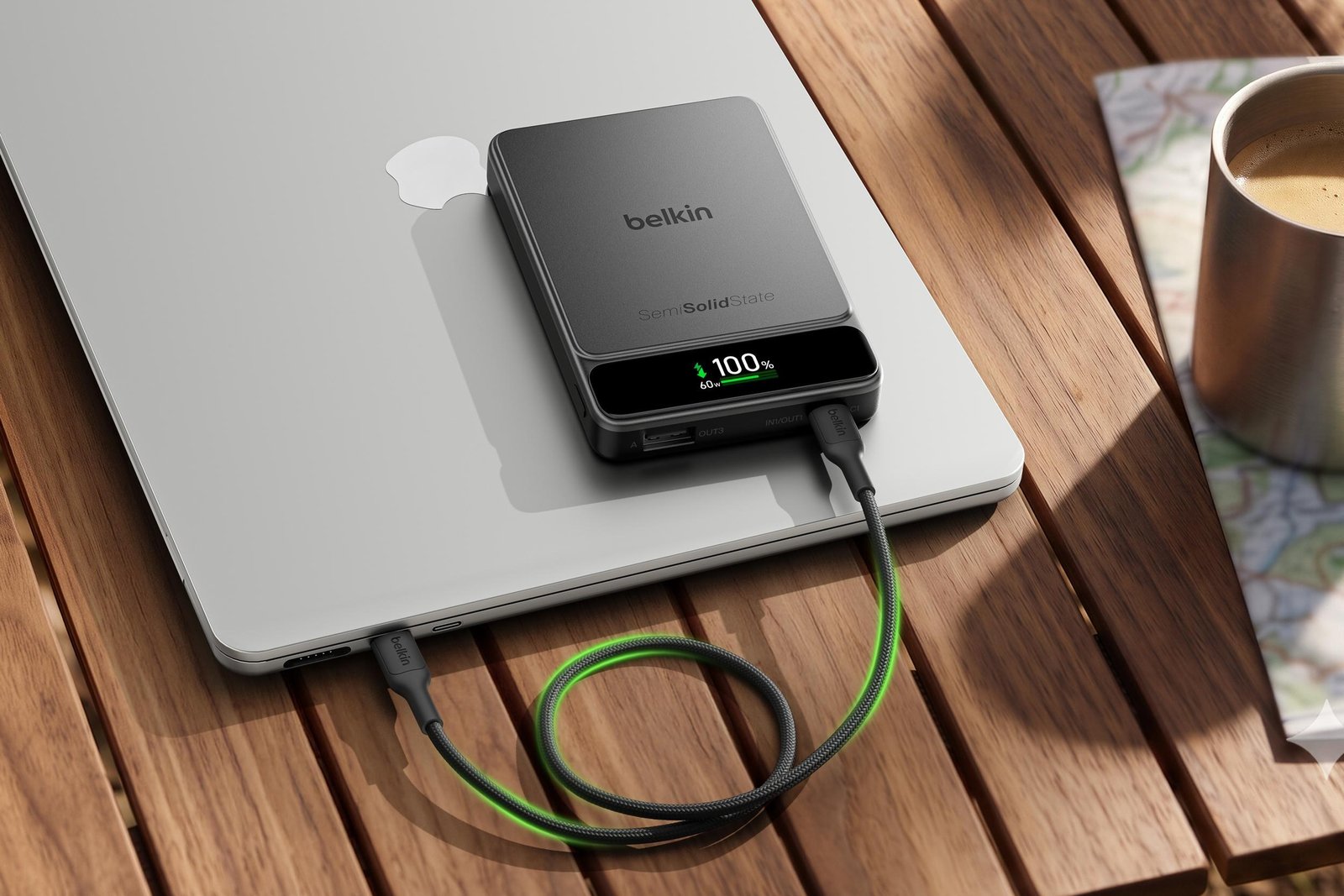 A power bank with Belkin’s BoostSolid Cell technology being used to charge a laptop with a USB-C cable.