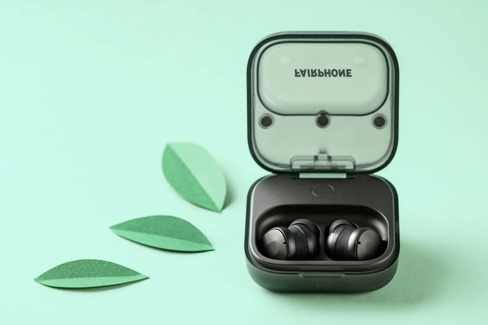 The original Fairphone Fairbuds in their charging case.