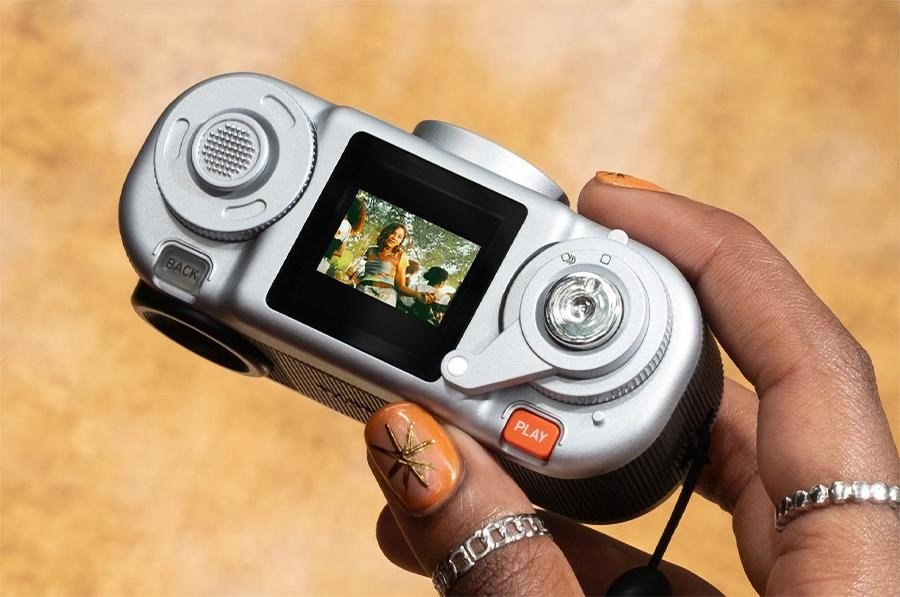 A close-up of the controls and LCD screen on top of the Fujifilm Instax Pal 2 camera. A close-up of the controls and LCD screen on top of the Fujifilm Instax Pal 2 camera.