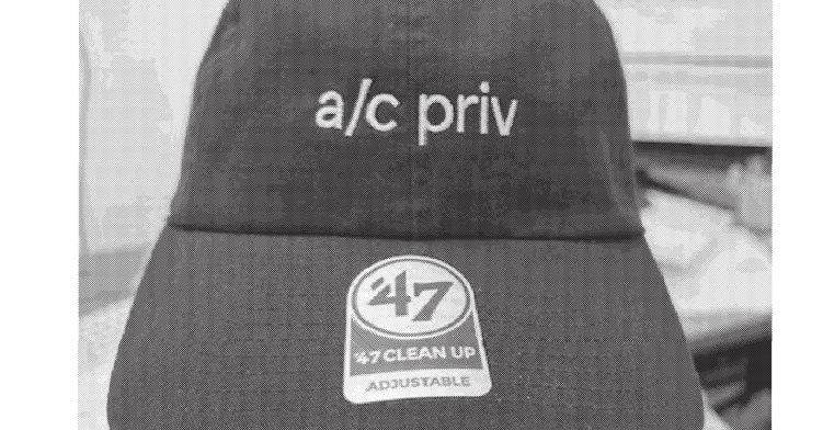 grayscale picture of a baseball cap with a/c priv across the front grayscale picture of a baseball cap with a/c priv across the front