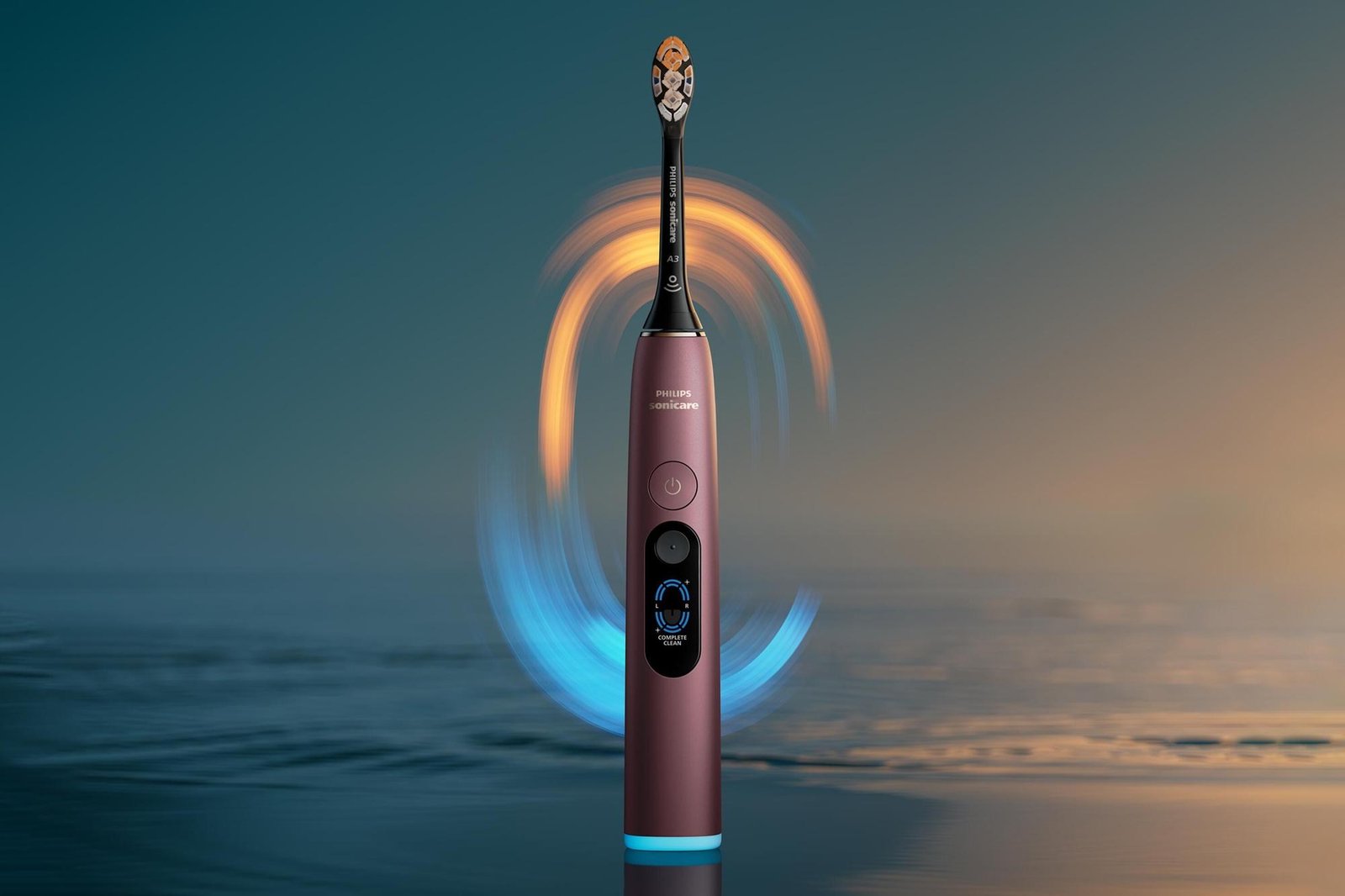 The Philips Sonicare Next-Generation DiamondClean 9900 Prestige smart toothbrush against a simulated background full of water.
