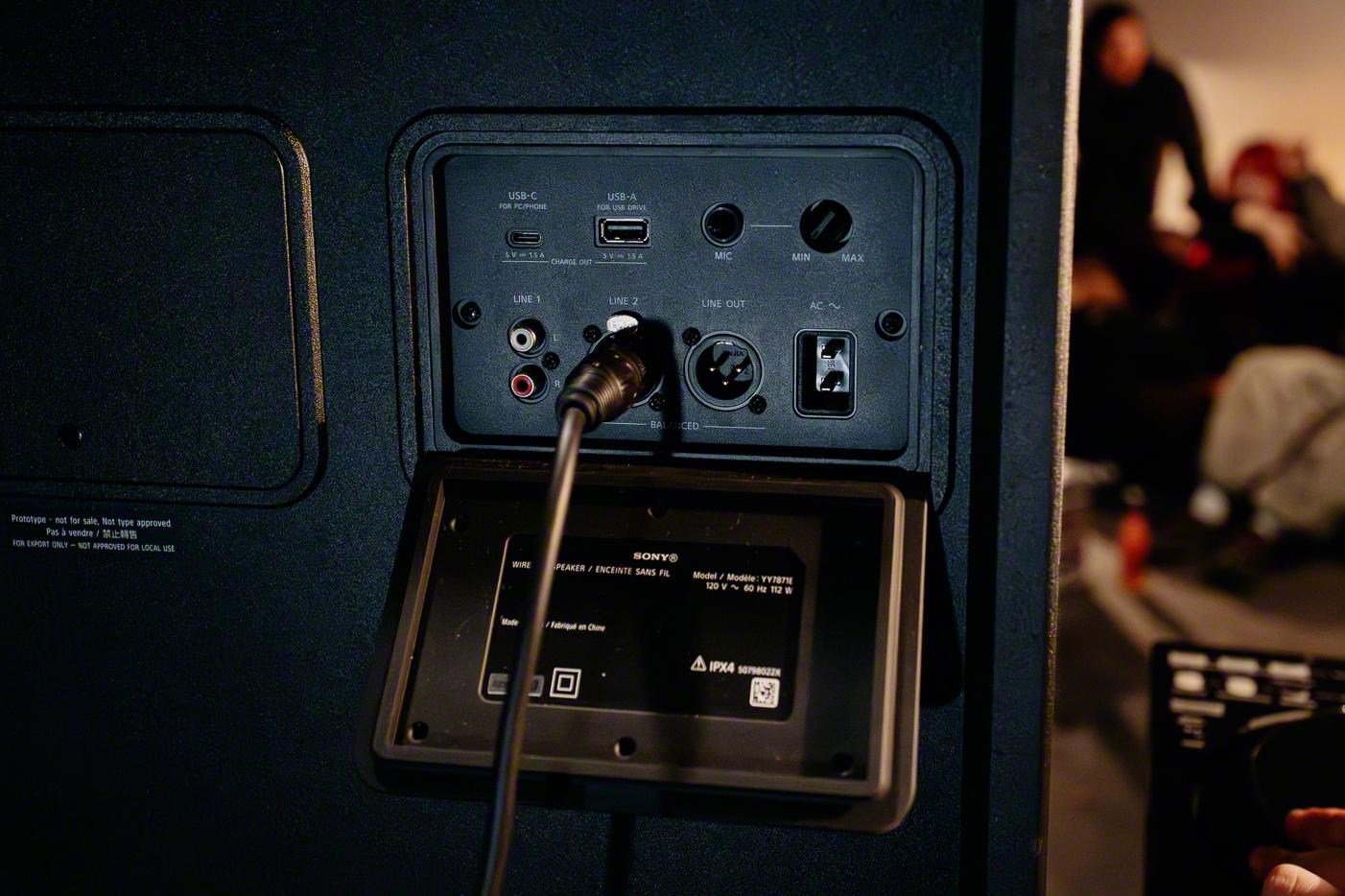 An access panel open on the back of the Sony ULT Tower 7 speaker showing various ports. An access panel open on the back of the Sony ULT Tower 7 speaker showing various ports.
